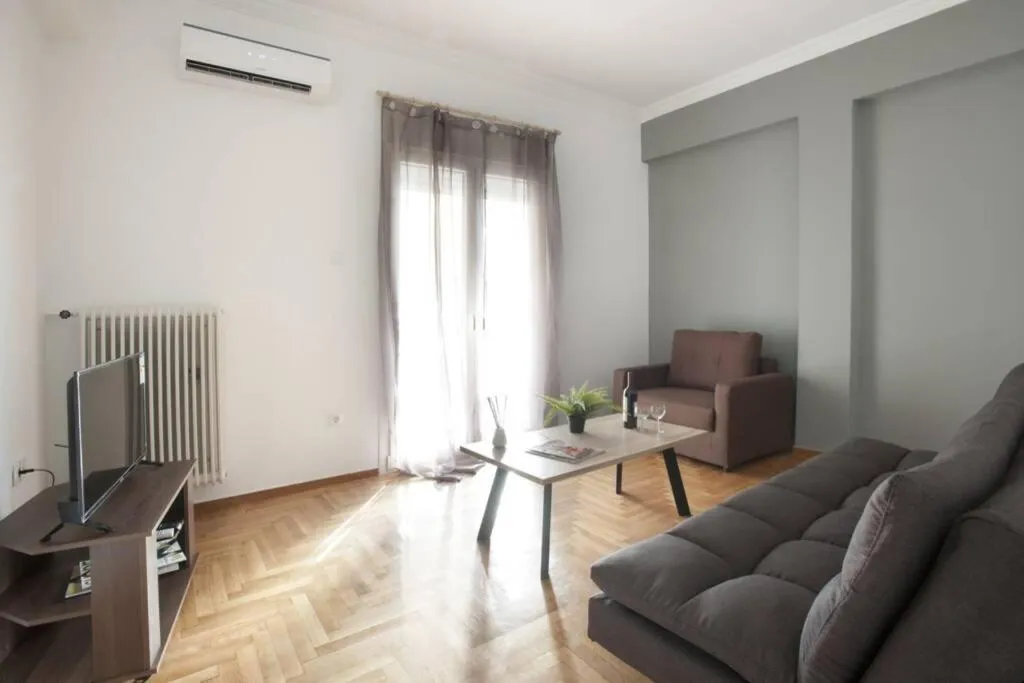 Communal lounge/ TV room in Kolonos, a renovated apartment