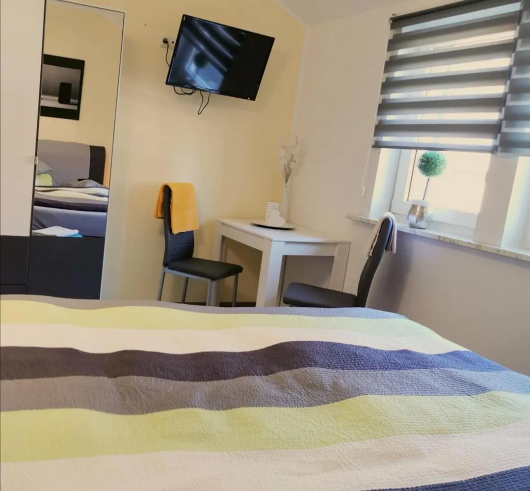 Seating area, Bed in Landhotel Heidkrug