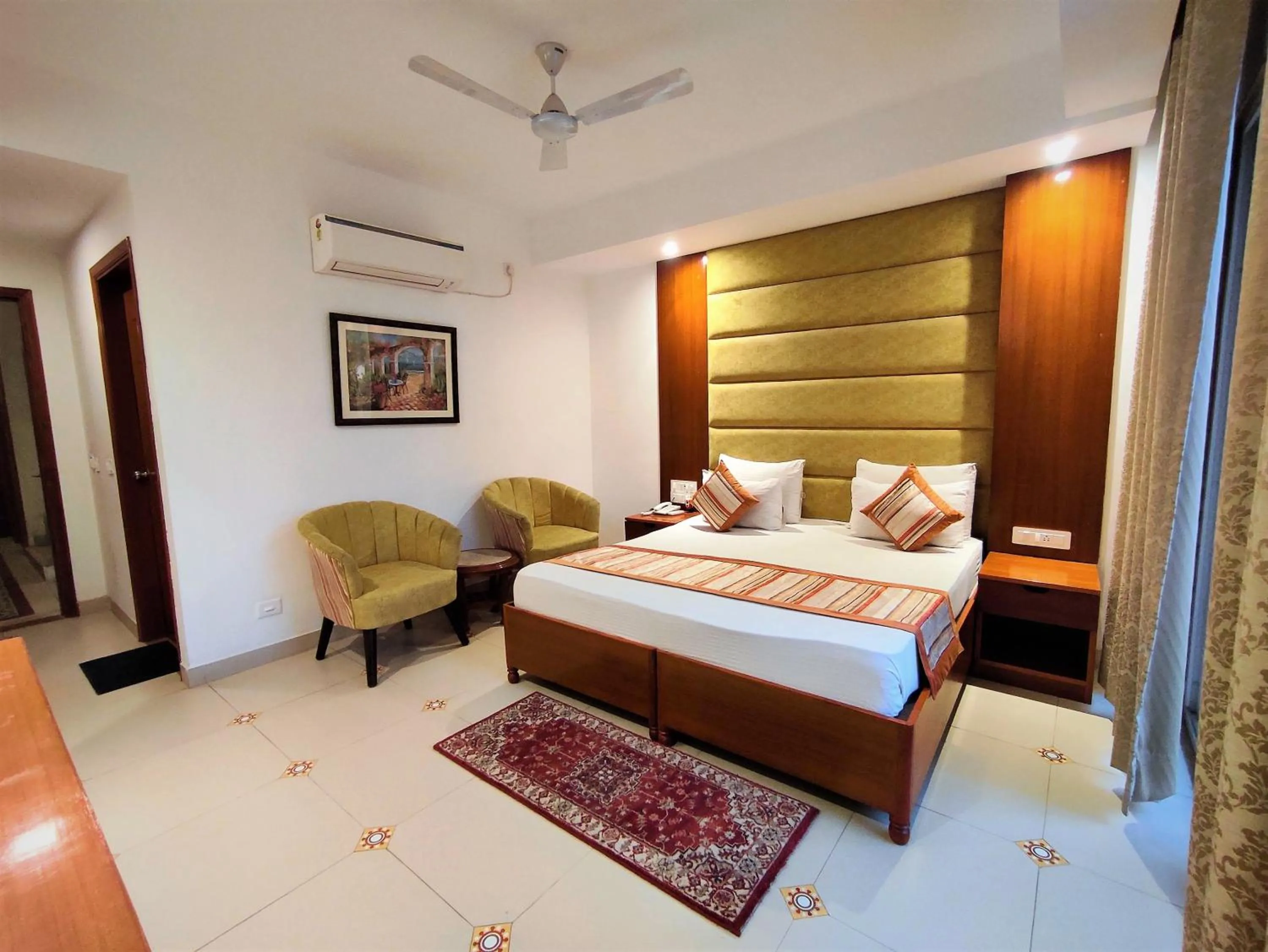 Photo of the whole room, Bed in The Angel Hotel & Suites near Medanta