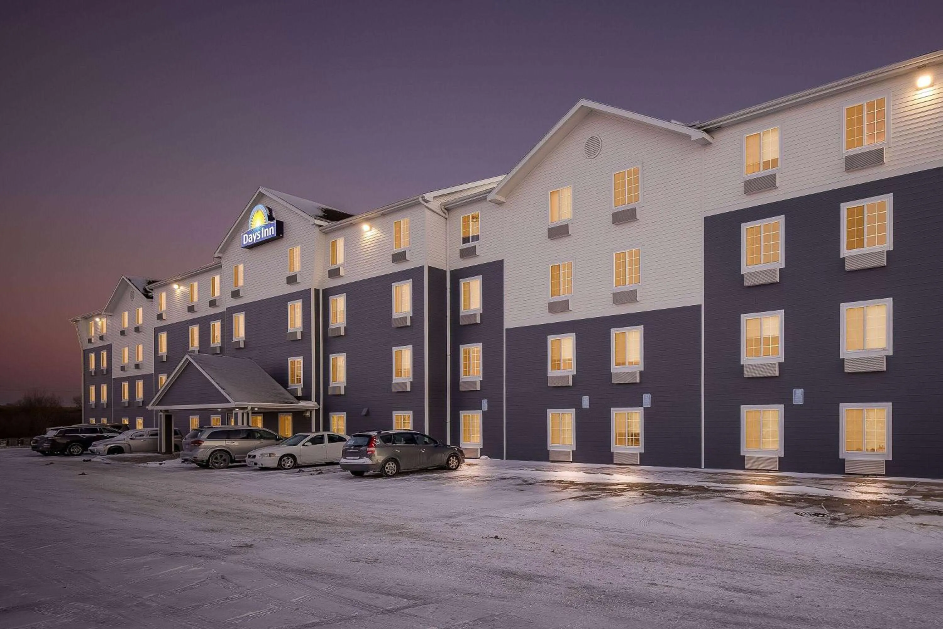 Property building in Days Inn & Suites by Wyndham Rochester South