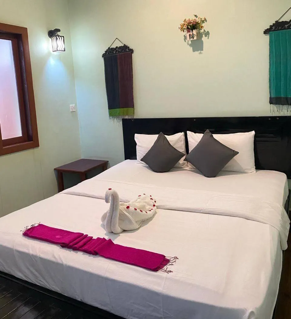 Bed in The Coconut House Hotel