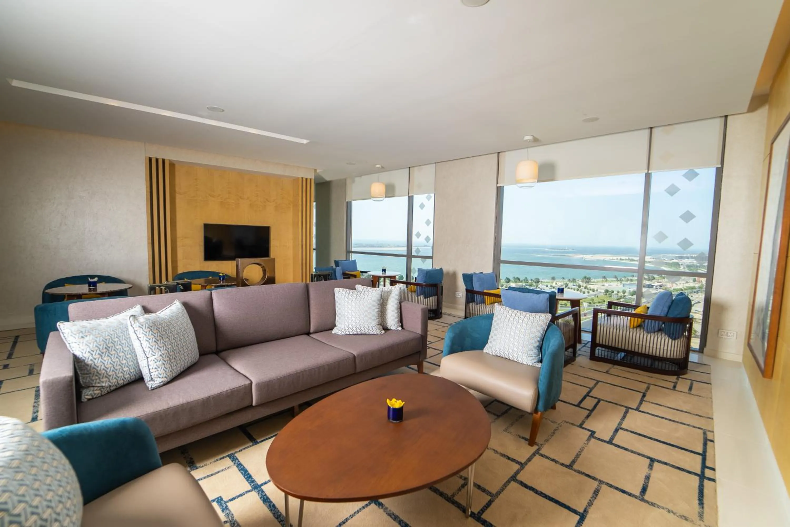 Communal lounge/ TV room in Dana Rayhaan by Rotana