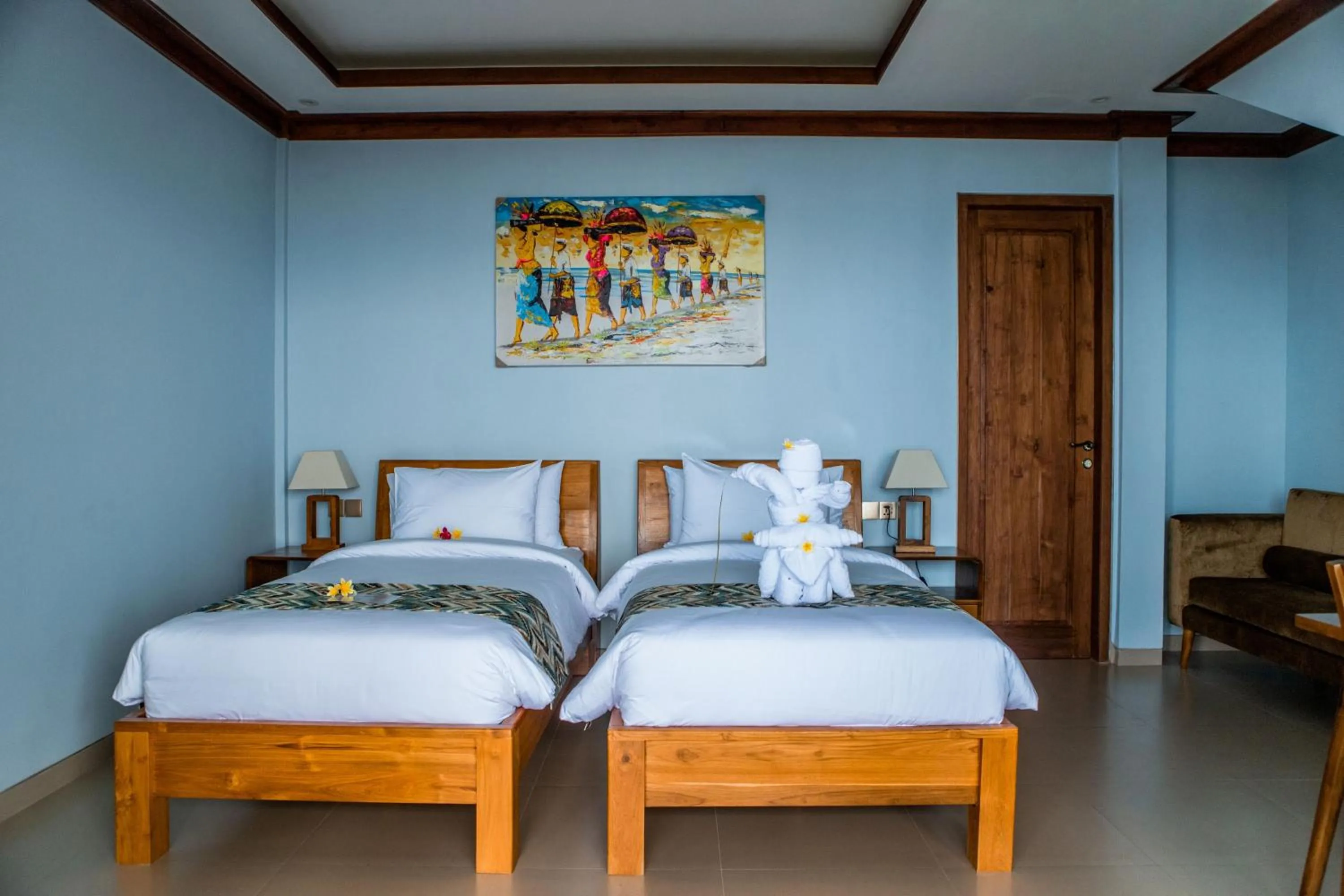 Bed in Blue Harbor Beachfront Villas & Resto