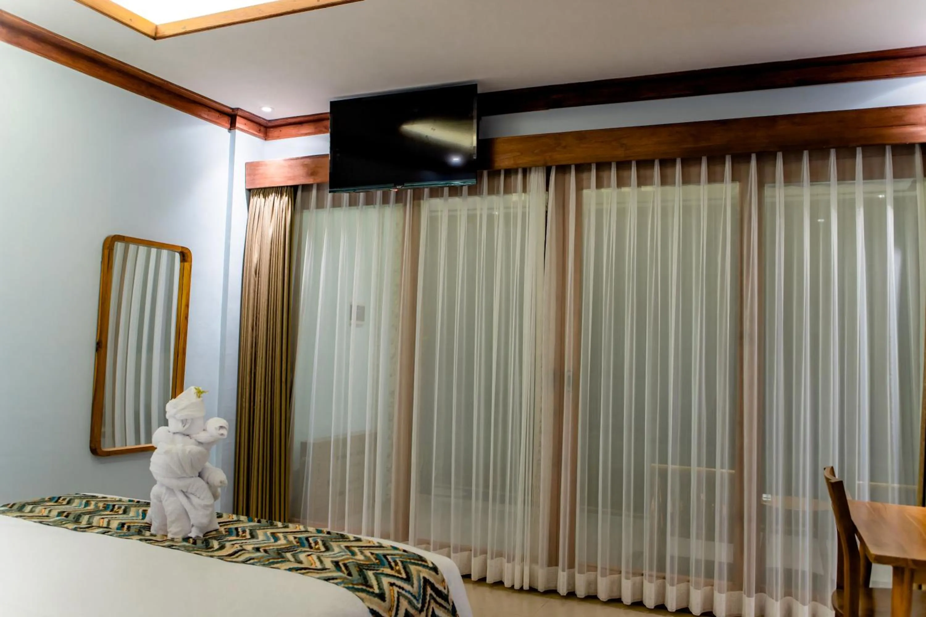 Bed in Blue Harbor Beachfront Villas & Resto