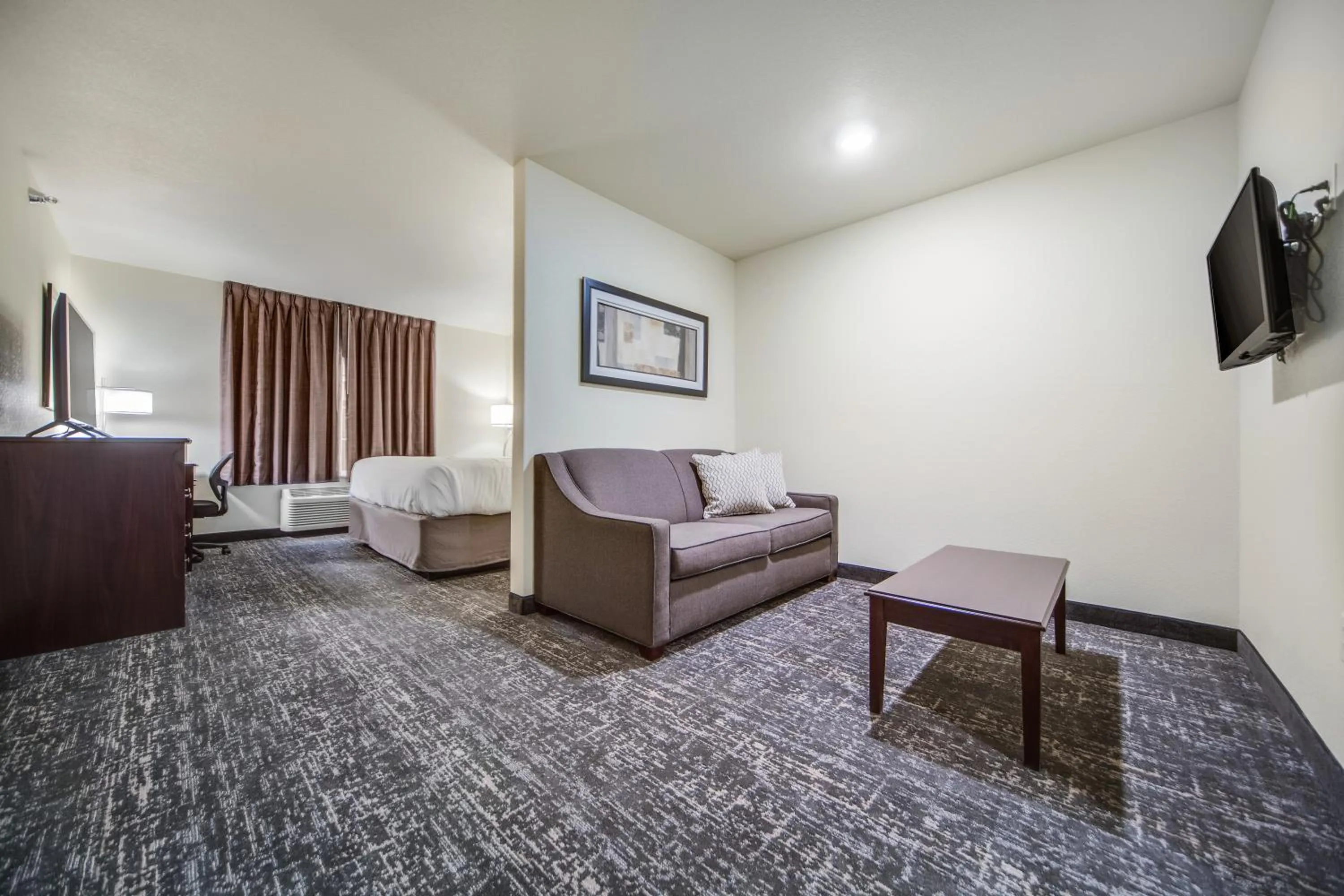 Bed in Cobblestone Hotel & Suites - Cozad