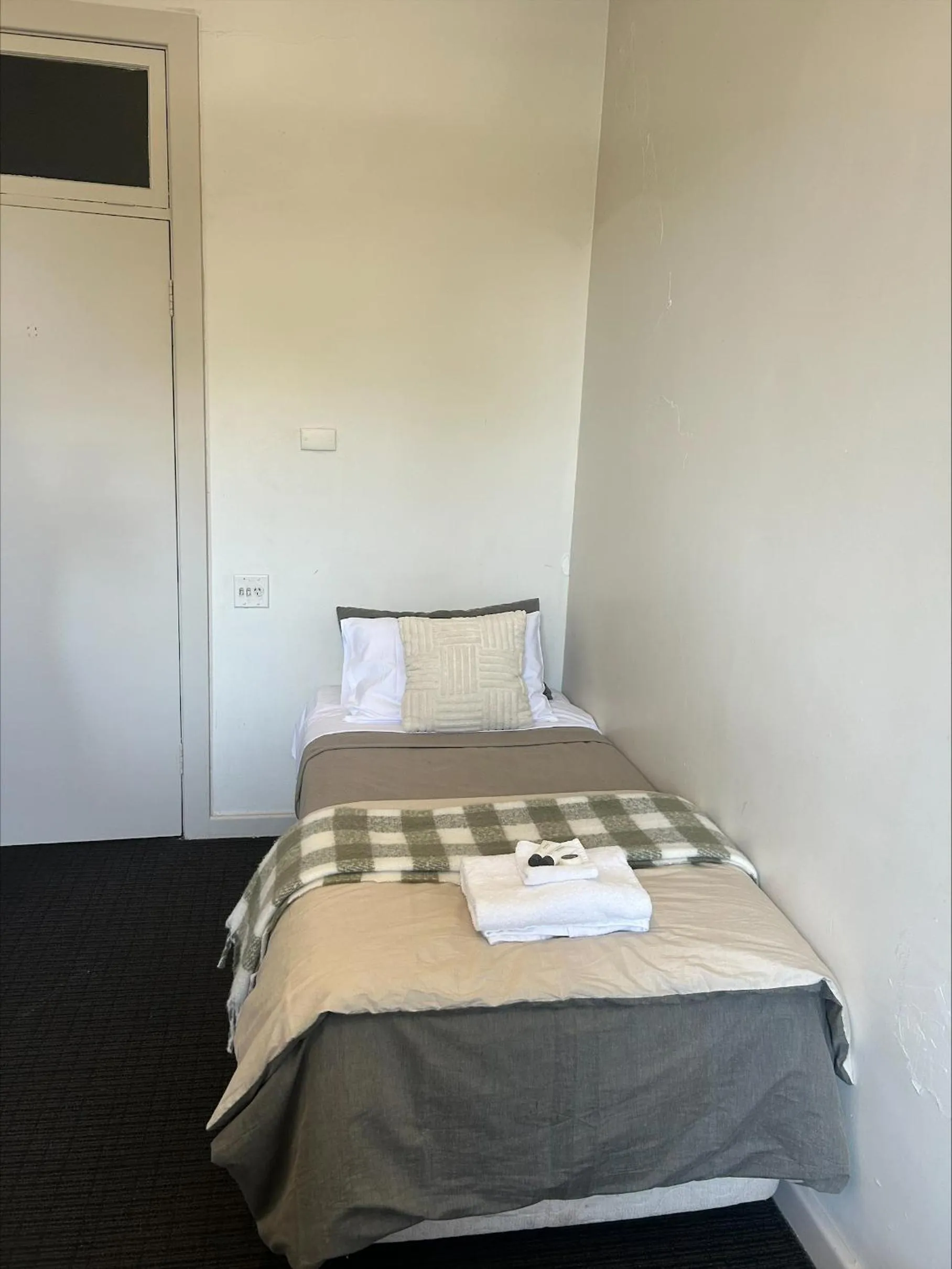 Bed in William Farrer Hotel