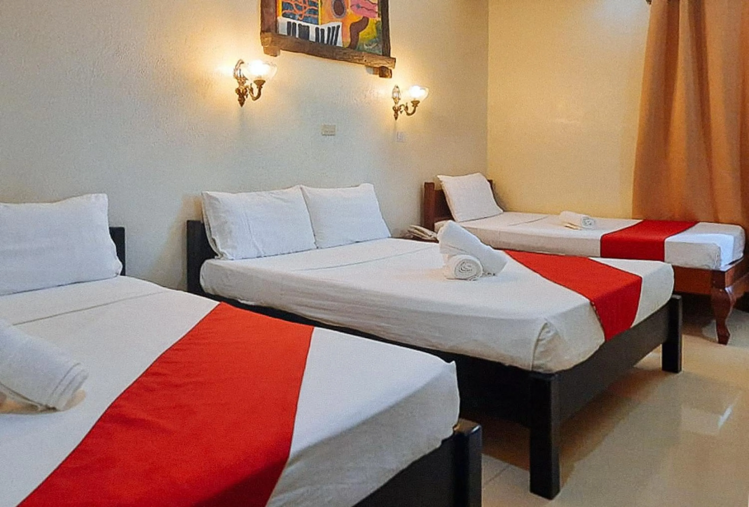 Bed in RedDoorz at New Casamila Hotel Palawan