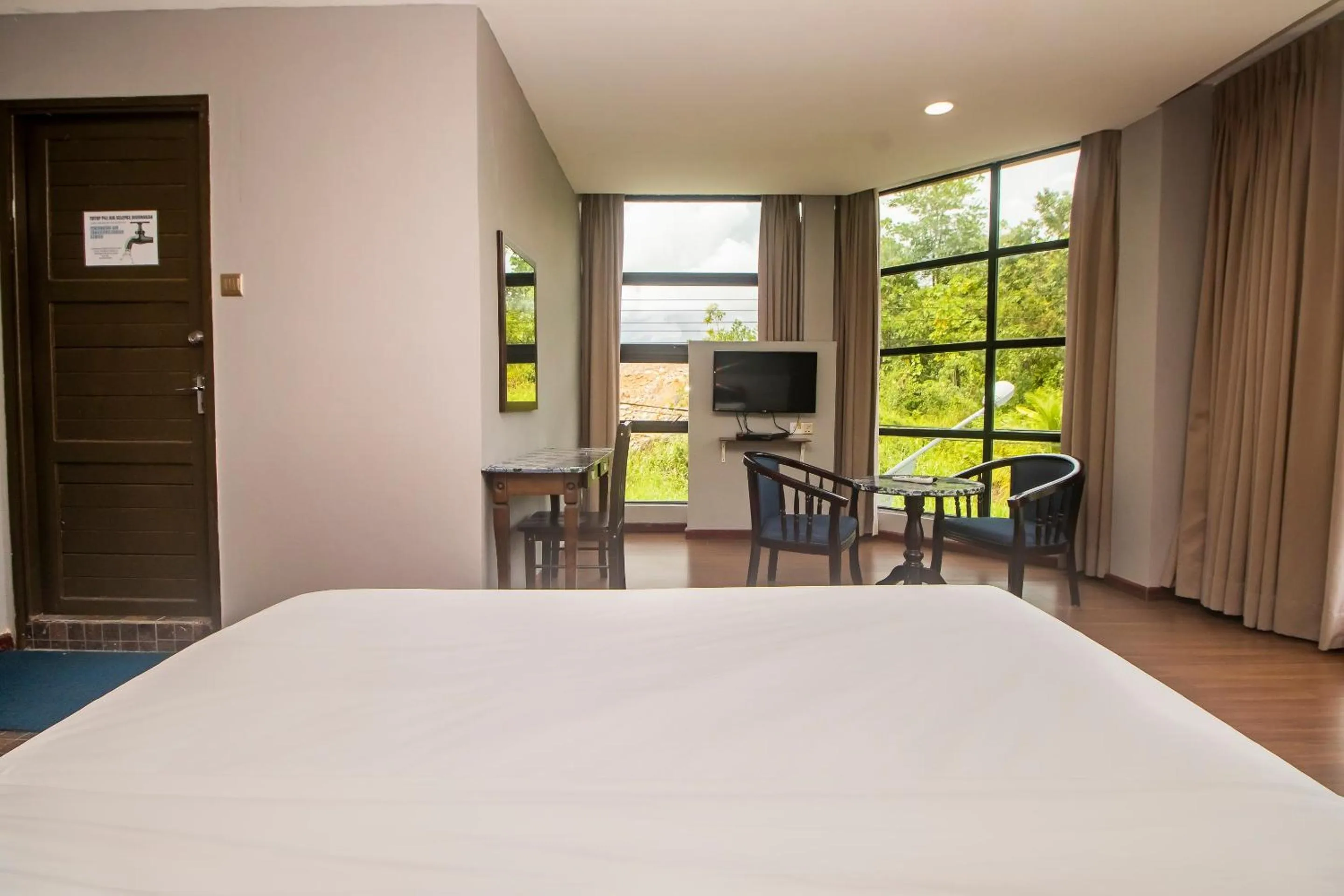 Bedroom in Hotel O Ltk Home