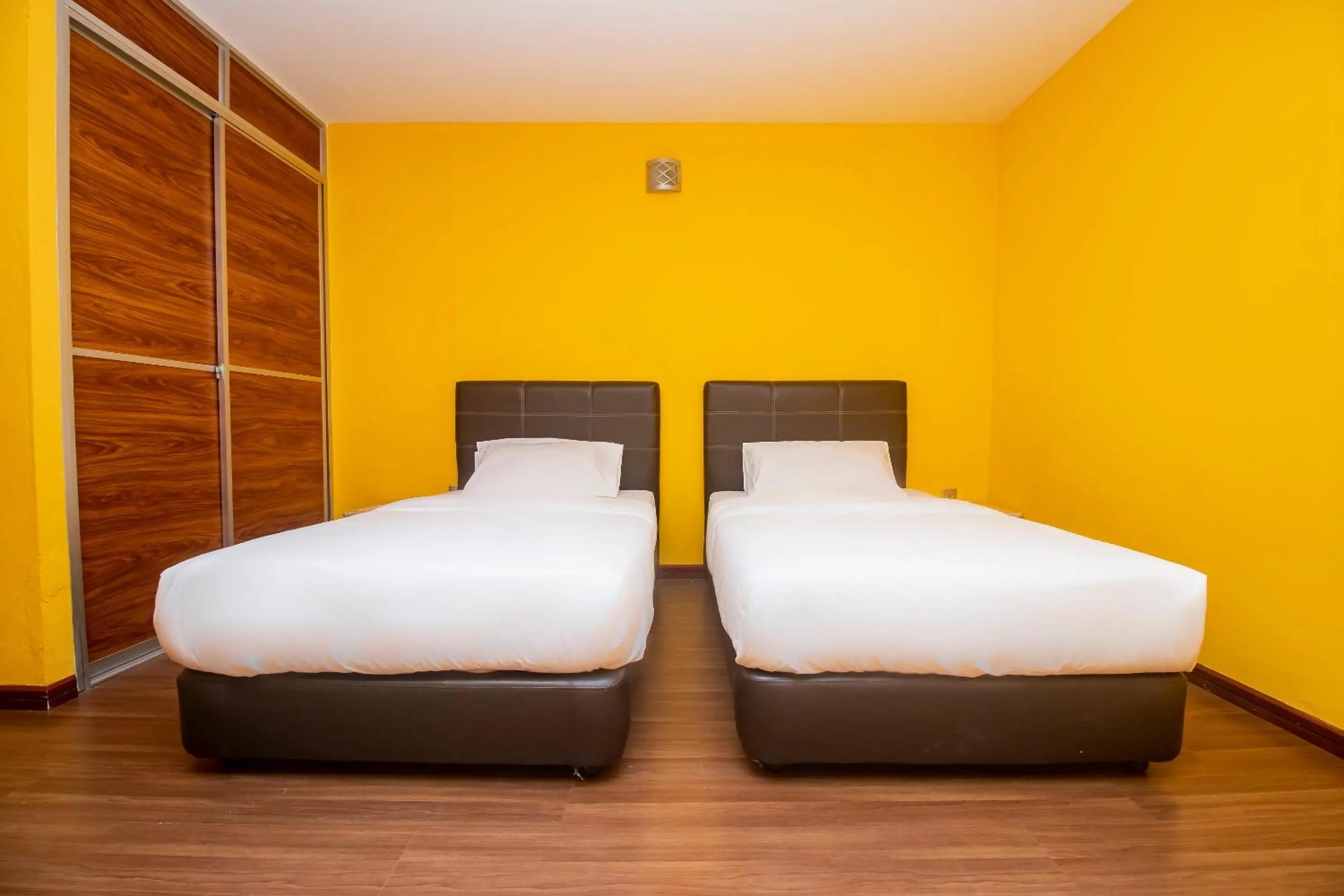 Bedroom in Hotel O Ltk Home