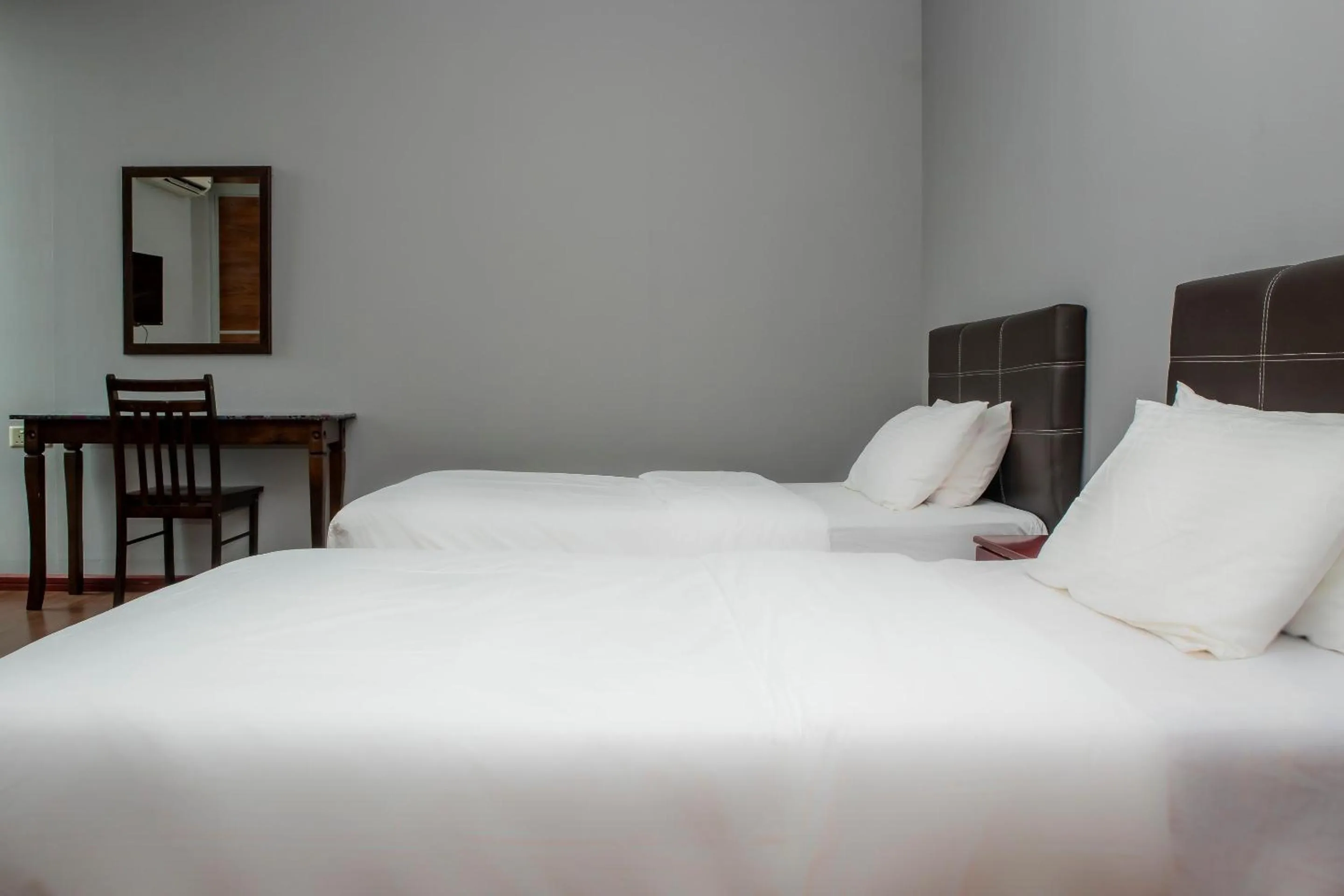 Bedroom in Hotel O Ltk Home