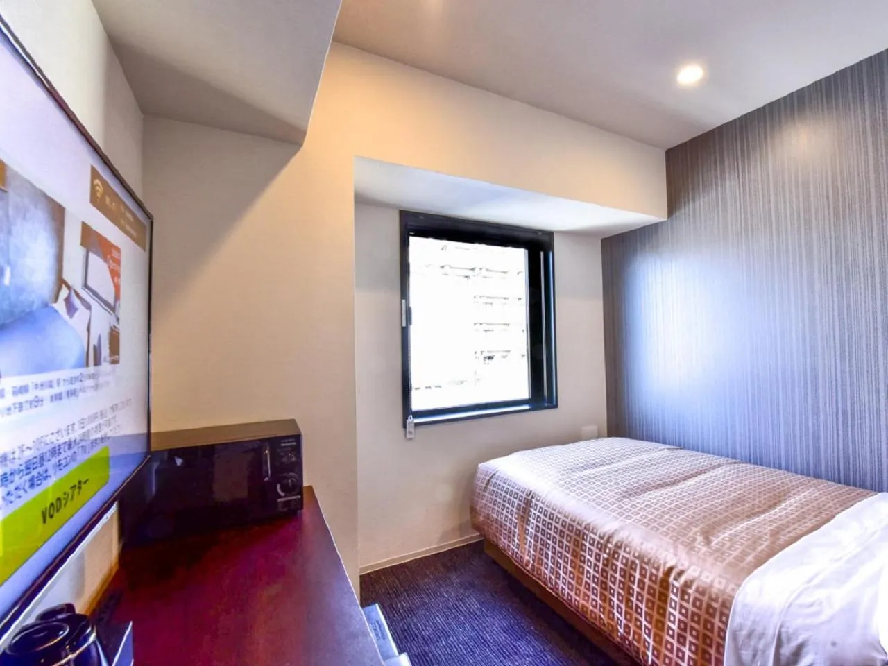 Bed in HOTEL LiVEMAX Hakata Nakasu