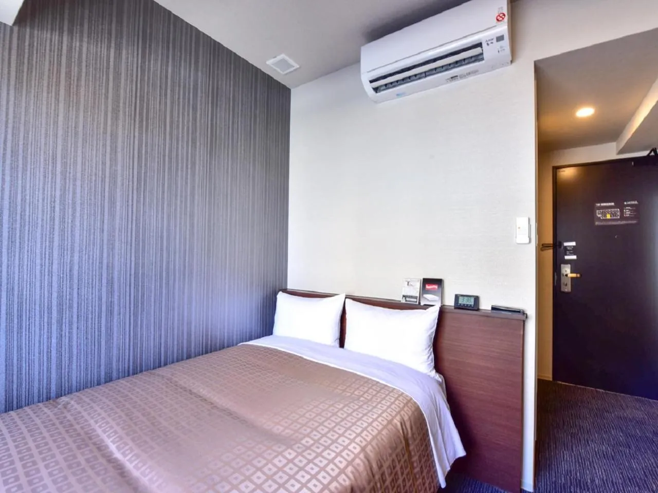 Bed in HOTEL LiVEMAX Hakata Nakasu