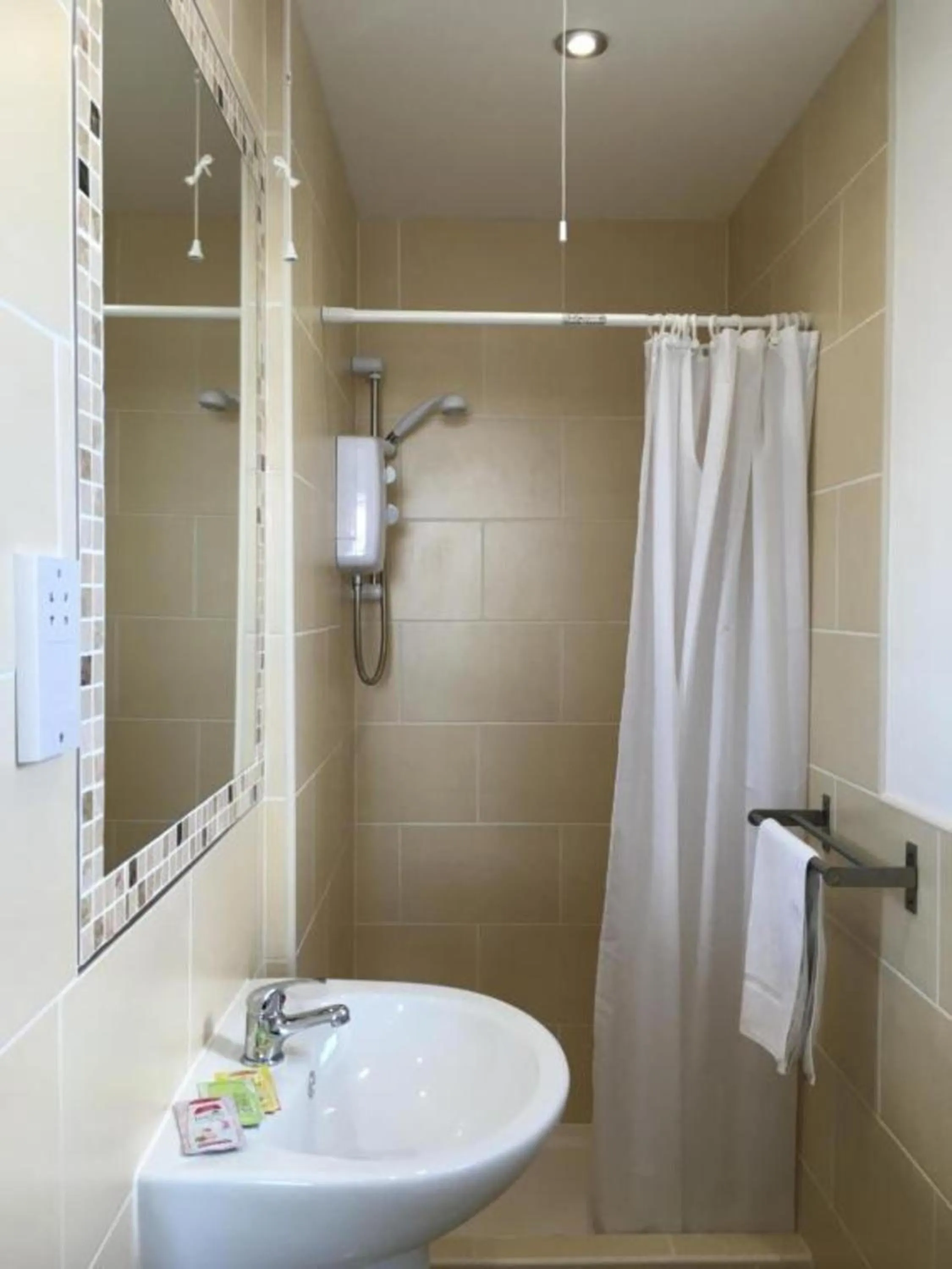 Bathroom in OYO Wave Crest Hotel