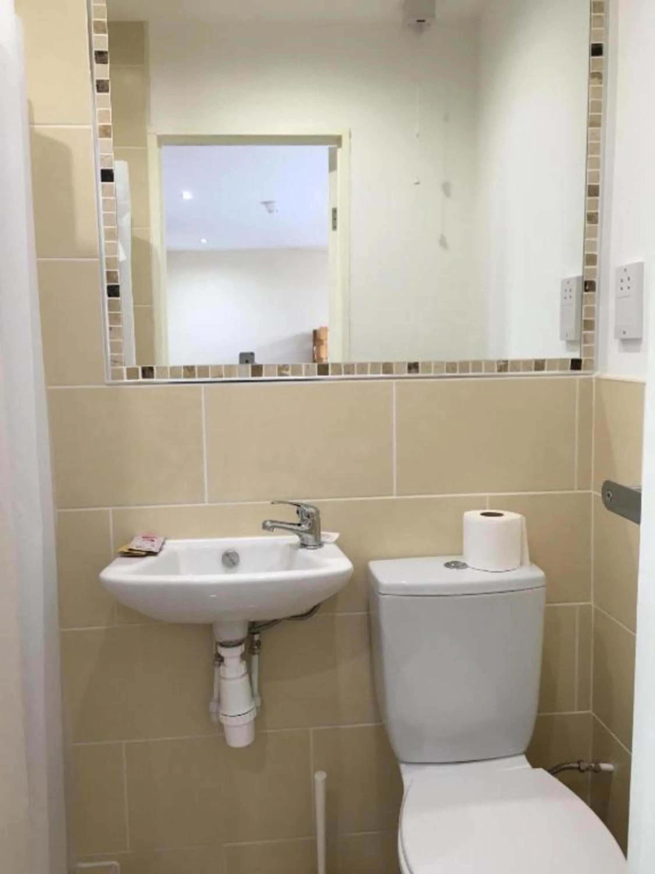 Bathroom in OYO Wave Crest Hotel