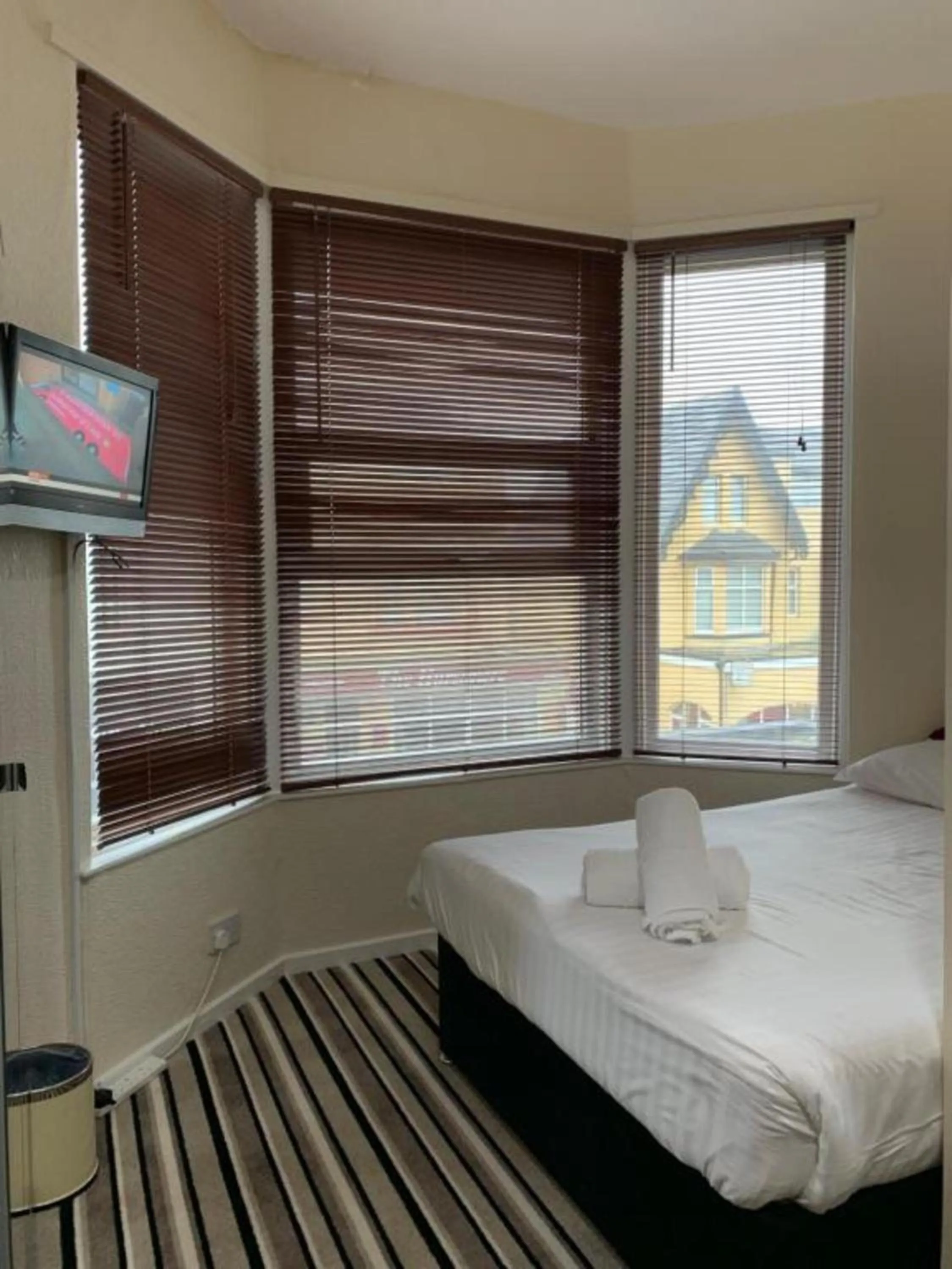 Bed in OYO Wave Crest Hotel