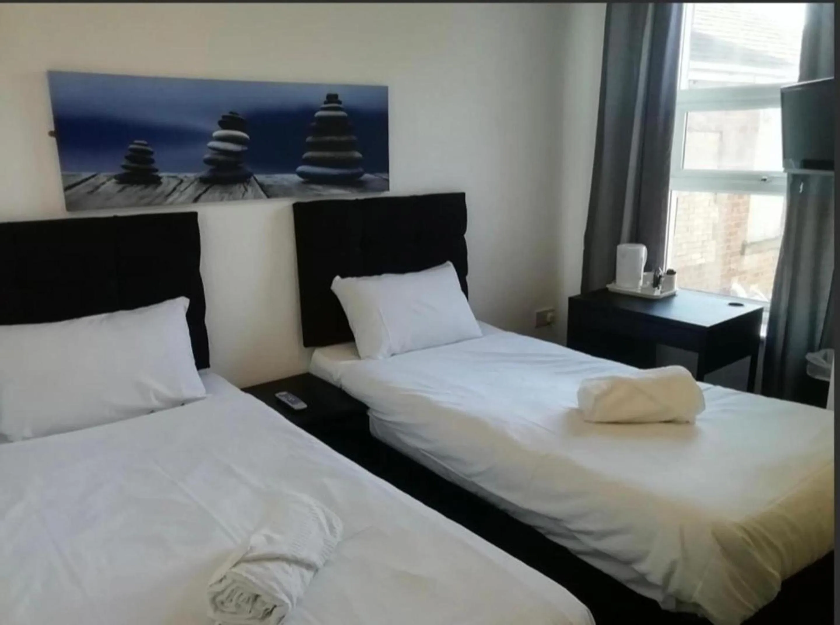 Bed in OYO Wave Crest Hotel