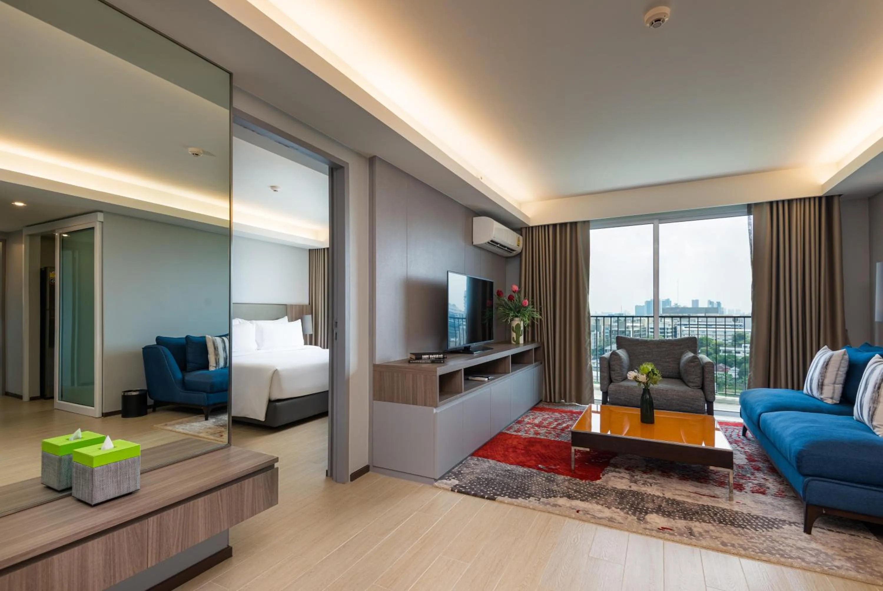 Living room, Bed in Maitria Hotel Rama 9 Bangkok - A Chatrium Collection