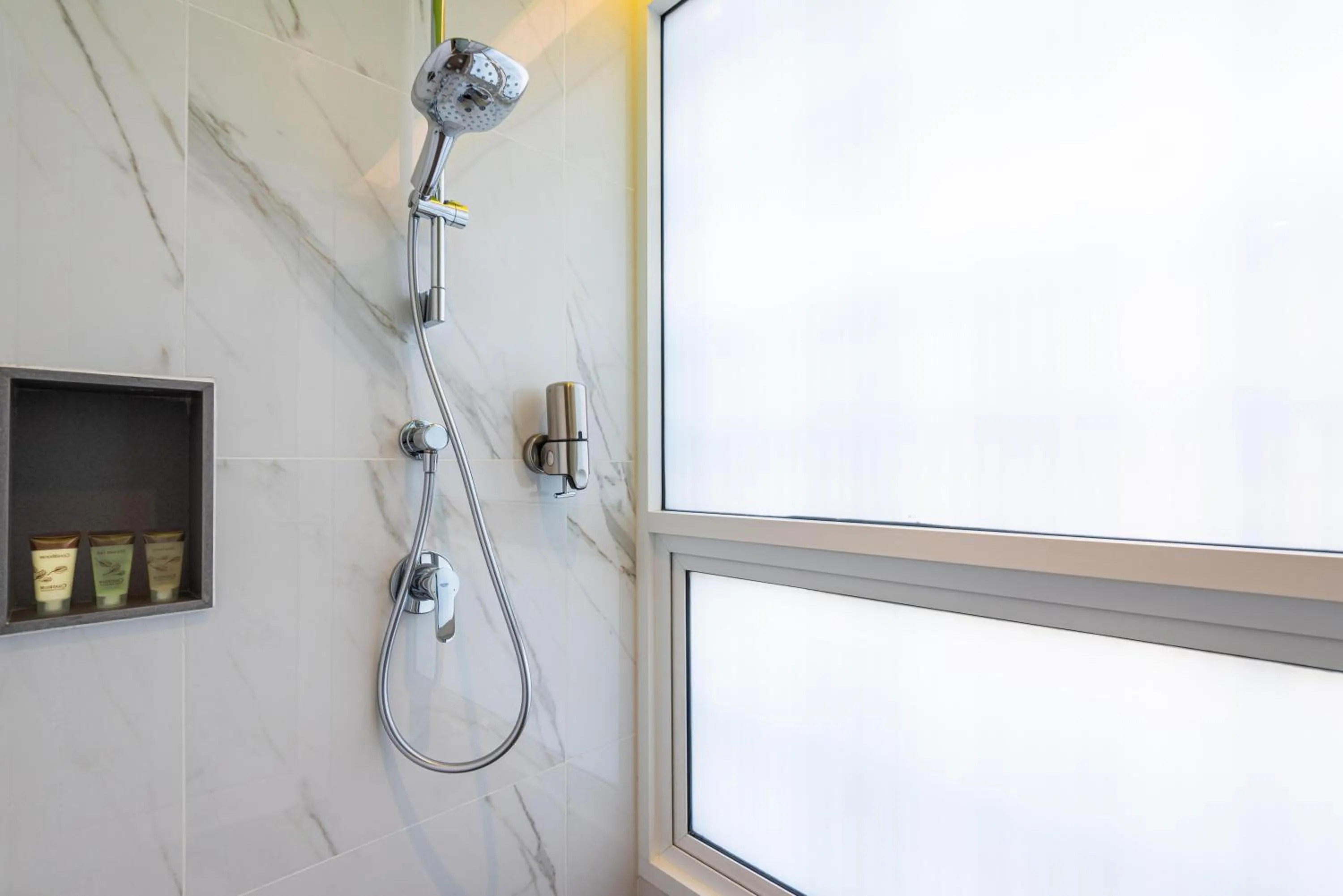 Shower in Maitria Hotel Rama 9 Bangkok - A Chatrium Collection