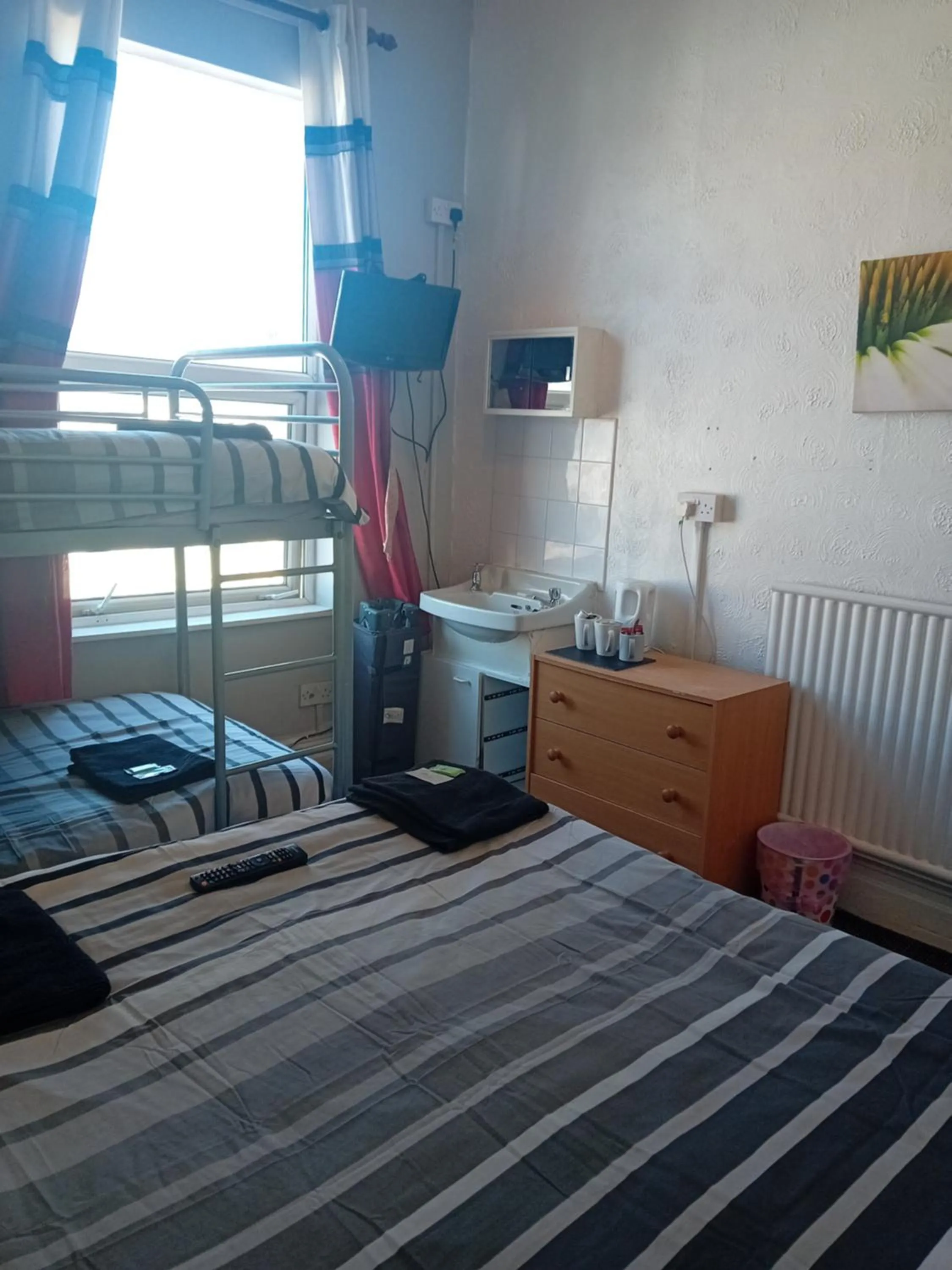 Bed in MyRoomz New Discovery Hotel