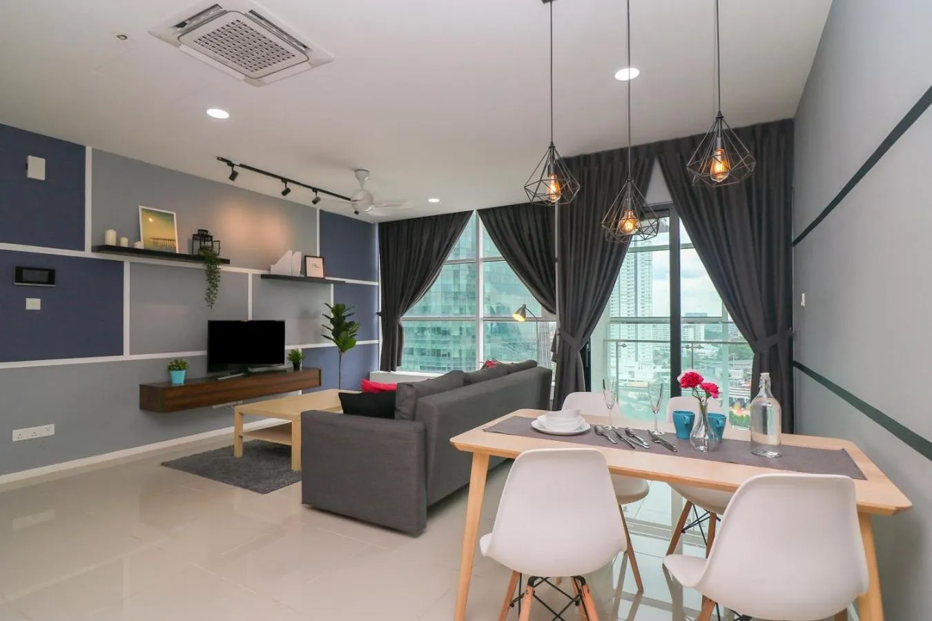 Living room in Suasana Residence by Nest Home