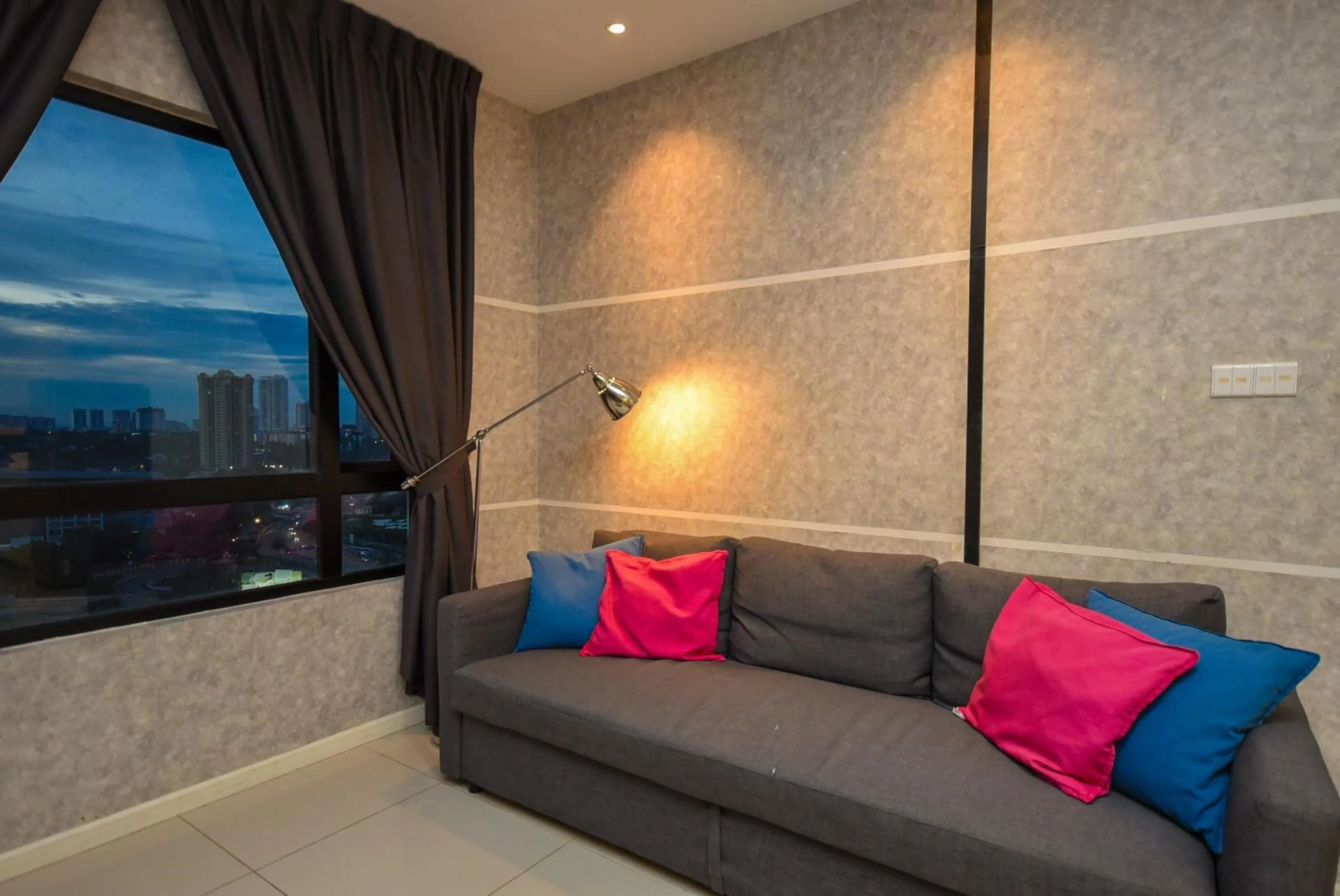 Living room in Suasana Residence by Nest Home