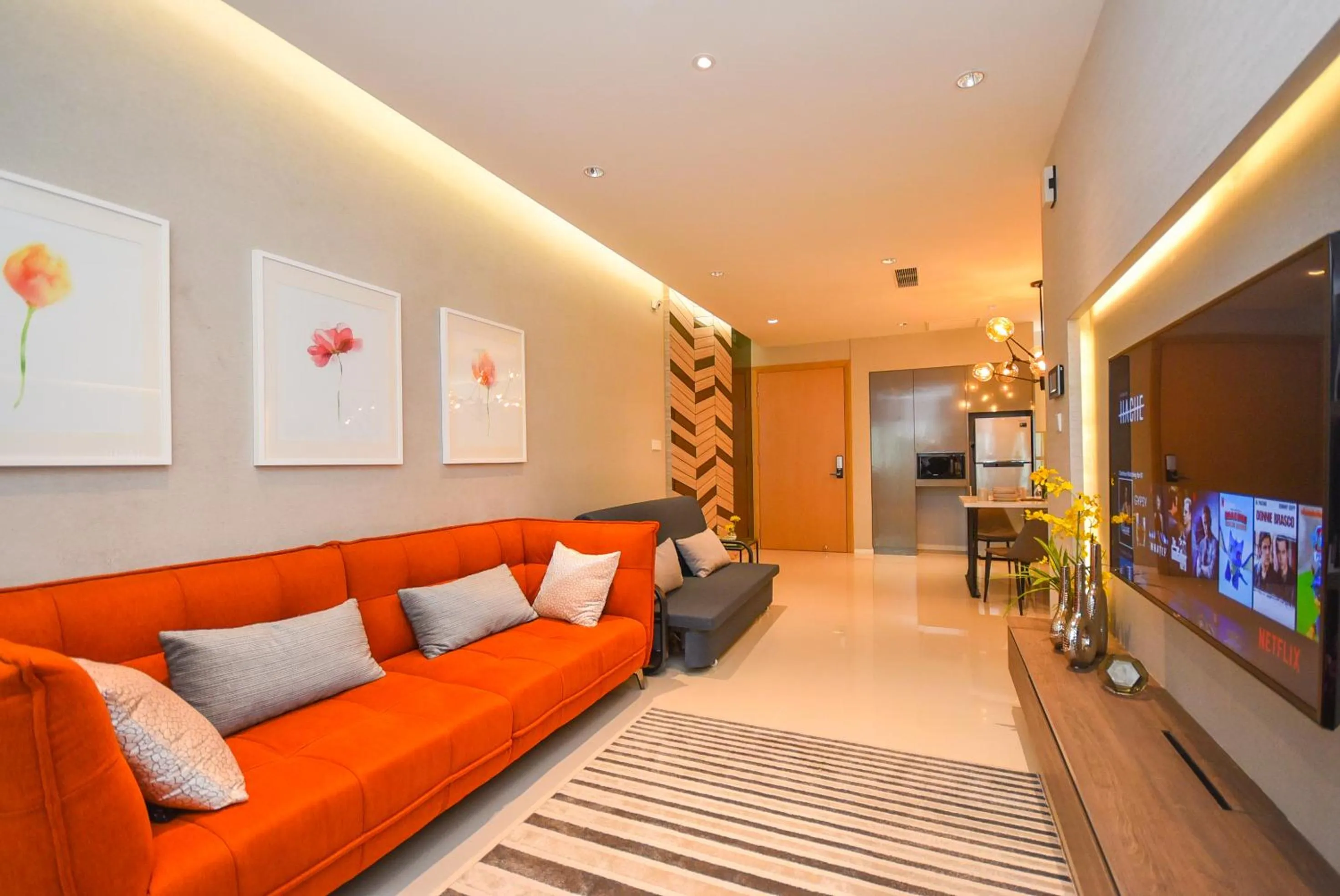 Living room in Suasana Residence by Nest Home