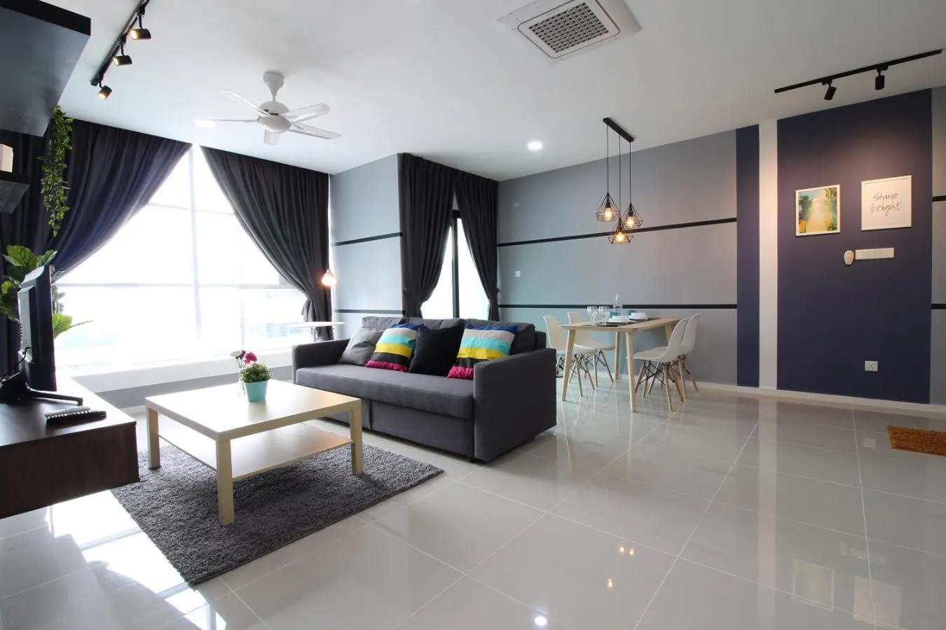 Living room in Suasana Residence by Nest Home