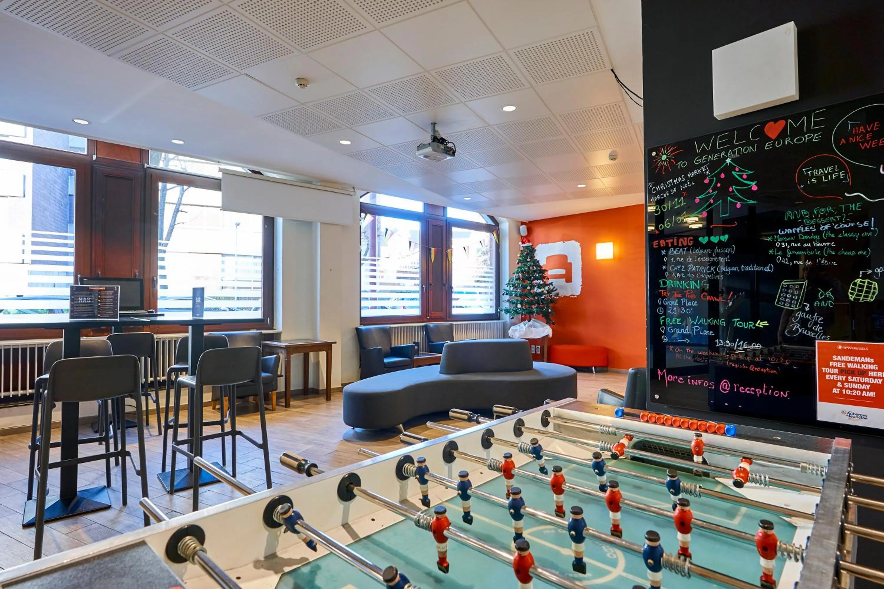 Communal lounge/ TV room in HI Brussels Generation Europe Hostel