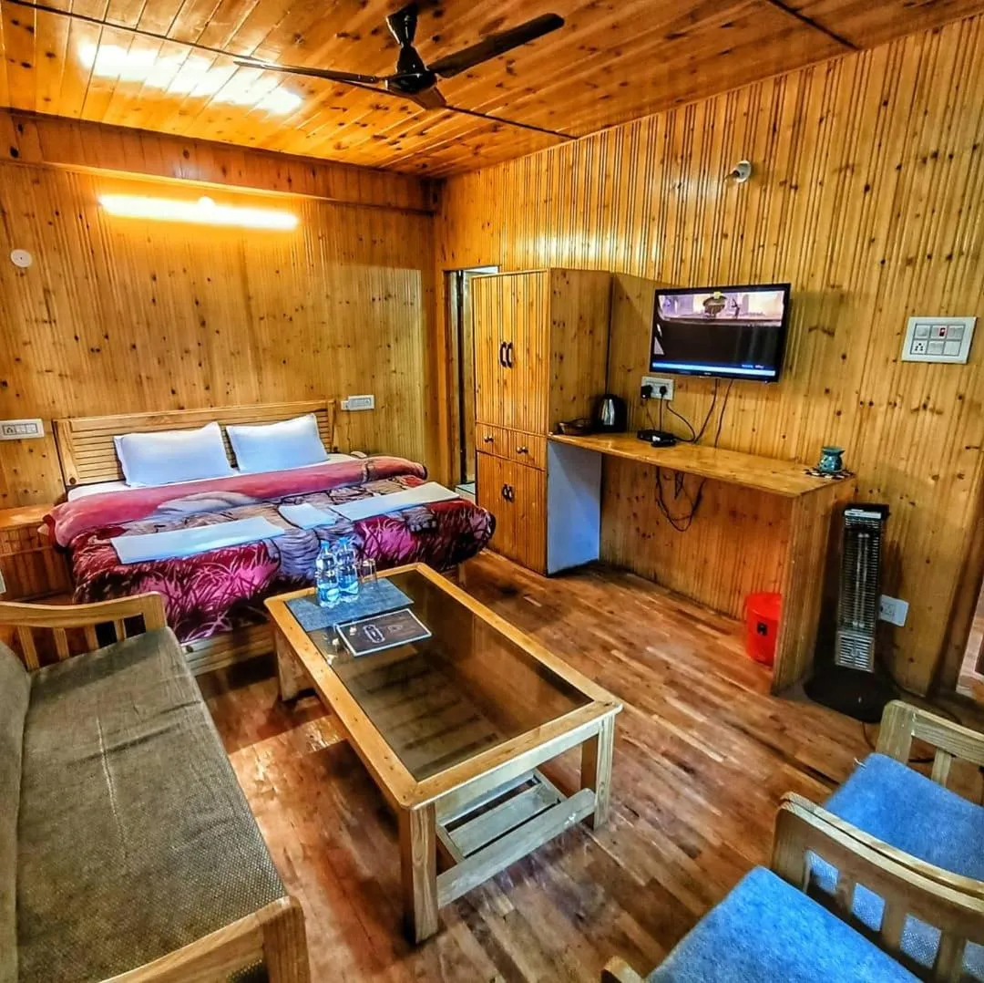 Photo of the whole room, Bed in Parvati Kuteer riverside resort