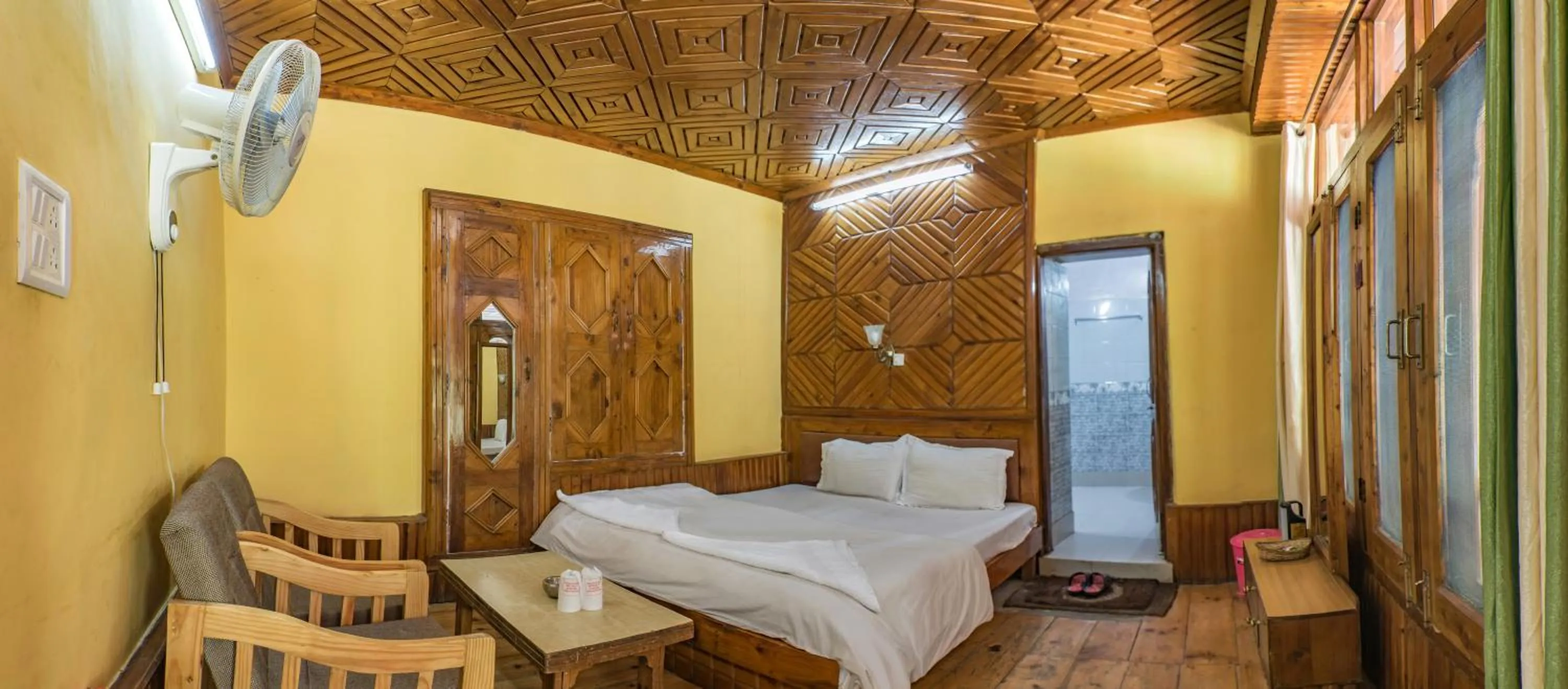 Bed in Parvati Kuteer riverside resort