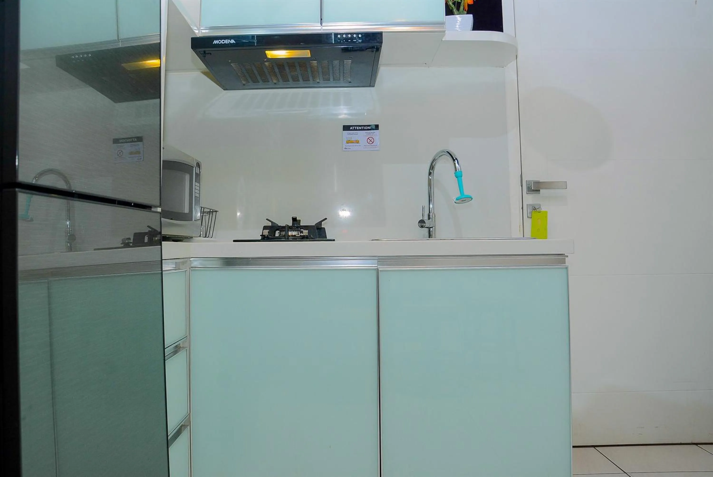 Kitchen or kitchenette in Comfy and Luxury 3BR Springlake Apartment By Travelio