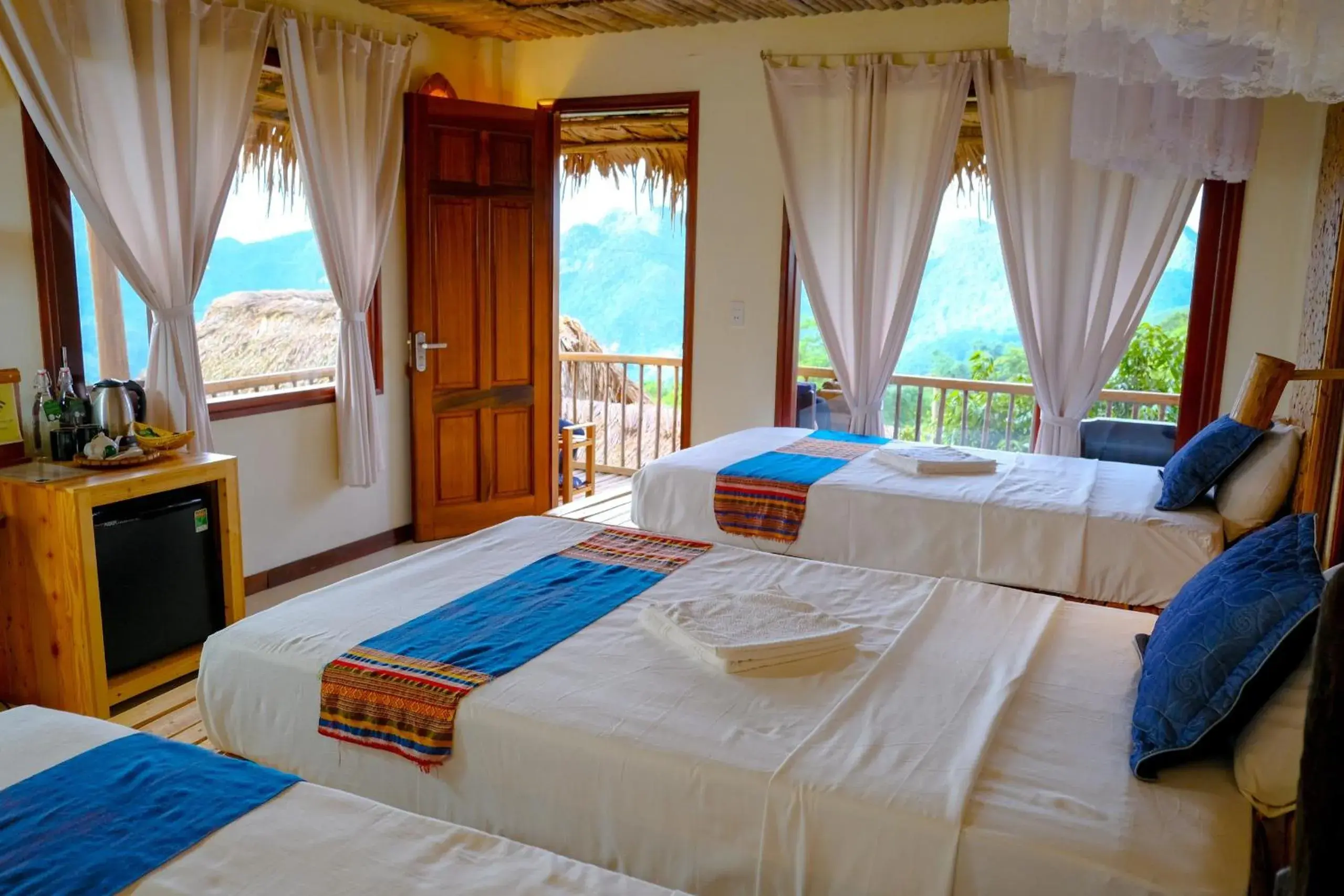 Triple Room with Balcony Mountain View in Pu Luong Jungle Lodge Triple Room with Balcony Mountain View in Pu Luong Jungle Lodge