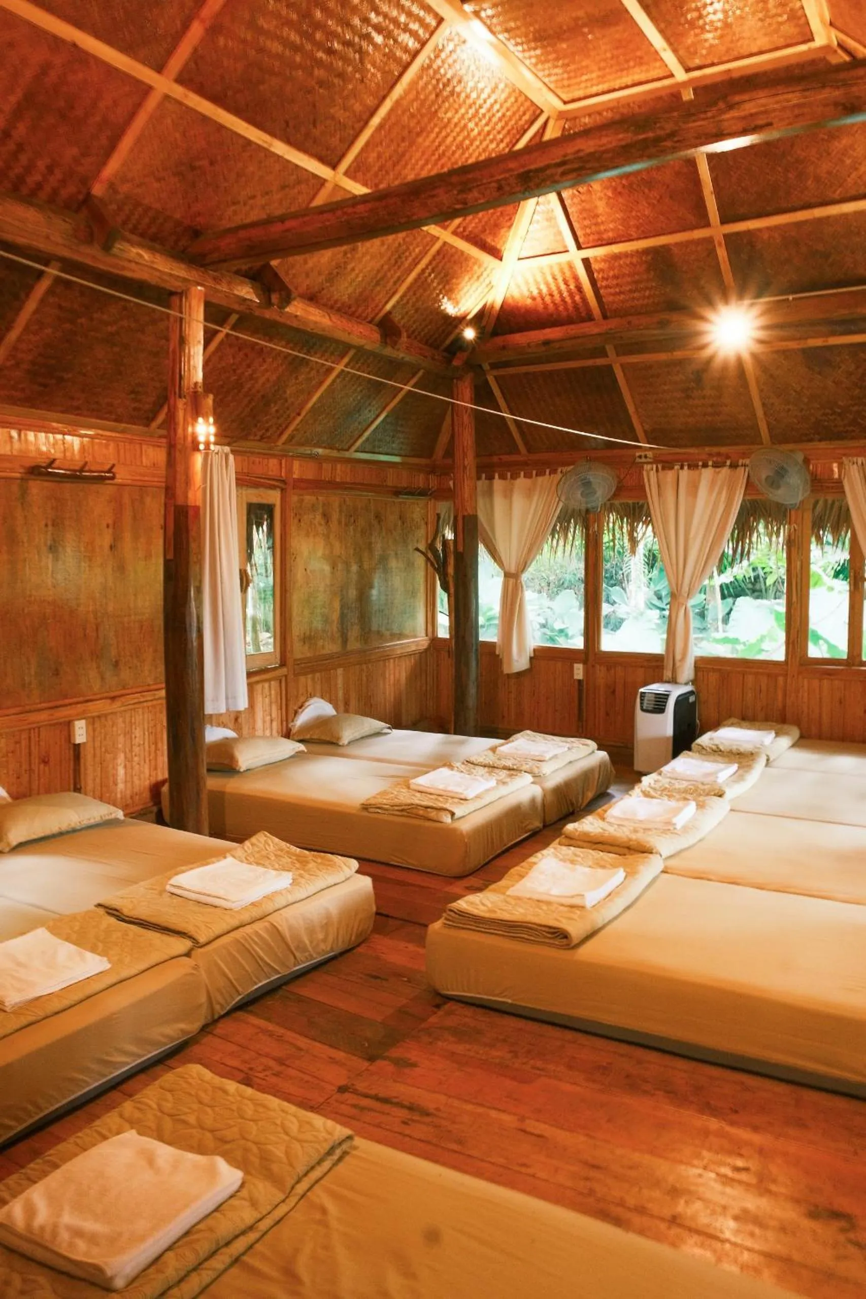 Bed in Pu Luong Jungle Lodge