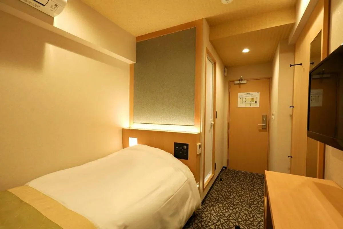 Bed in Hotel Matsunoi