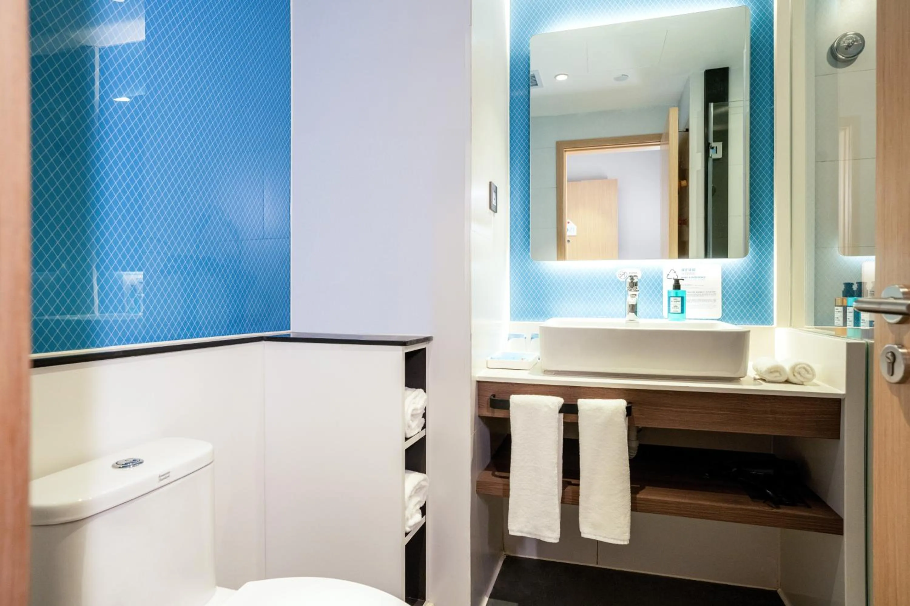 Toilet in Holiday Inn Express Urumqi Station by IHG