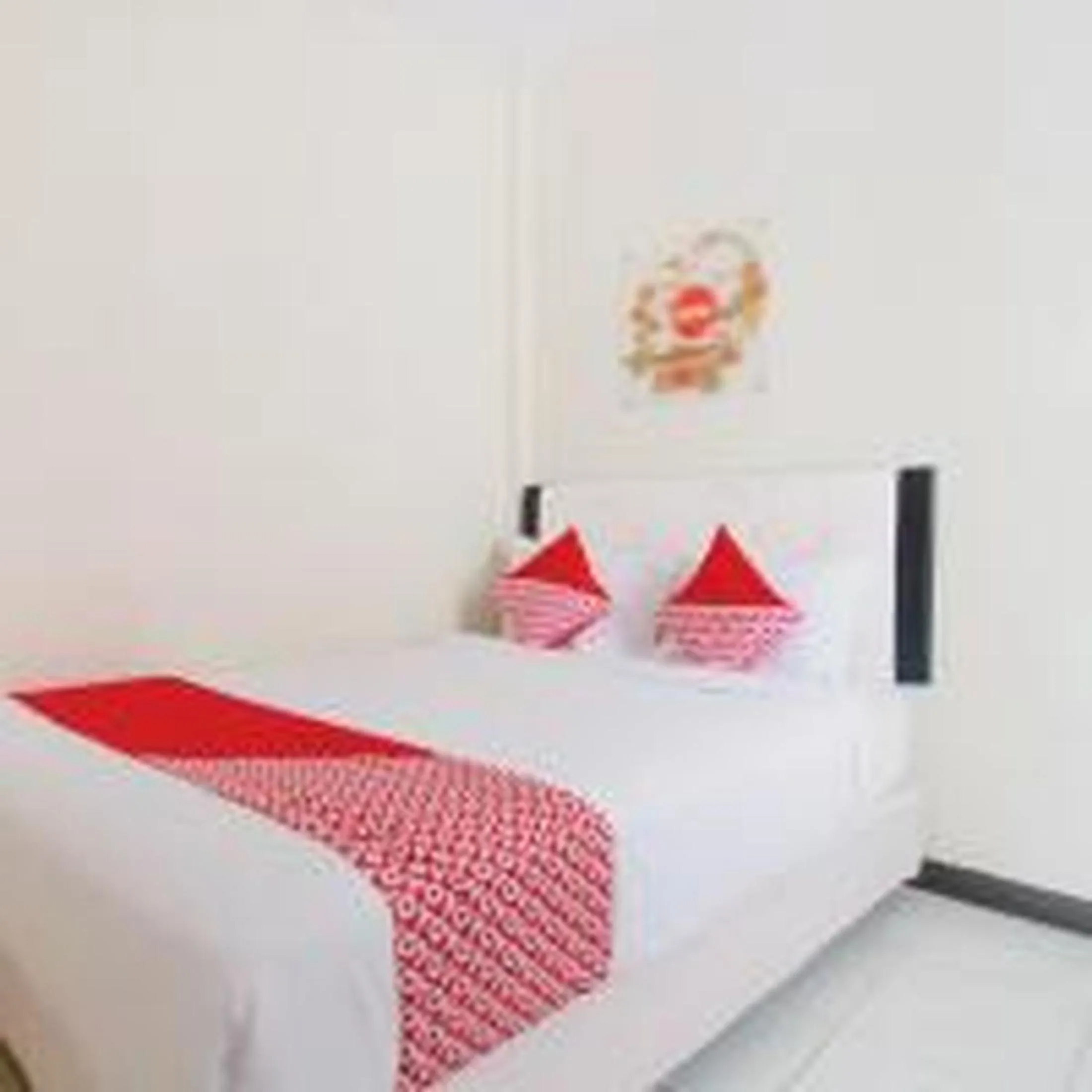 Bed in Hotel O Cozy Residence Syariah