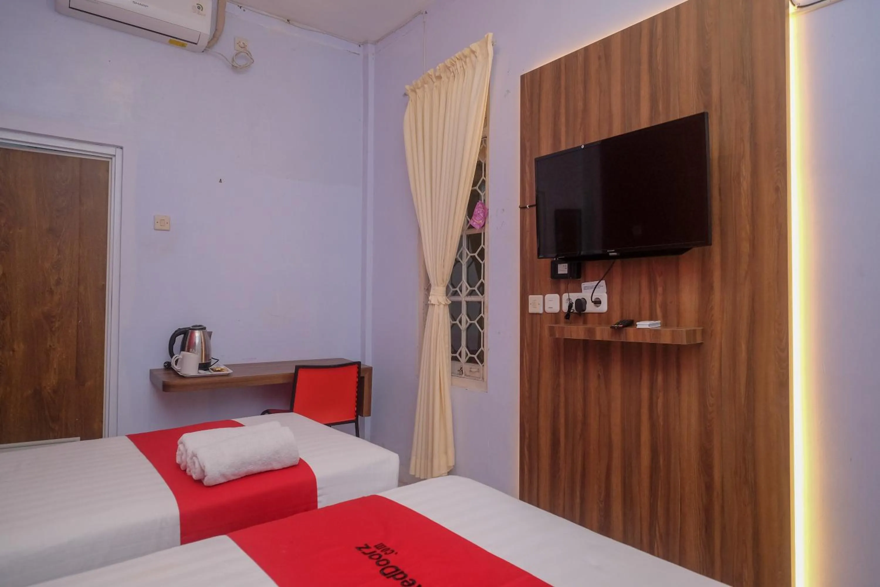 Bed in RedDoorz At Pondok Eyang Obi Sleman