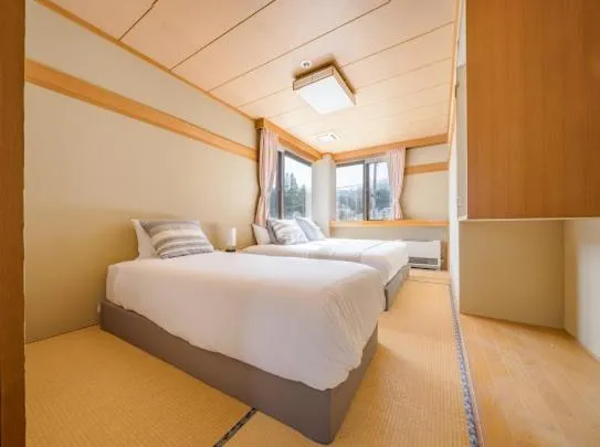 Bed in Red Fox Lodge Myoko