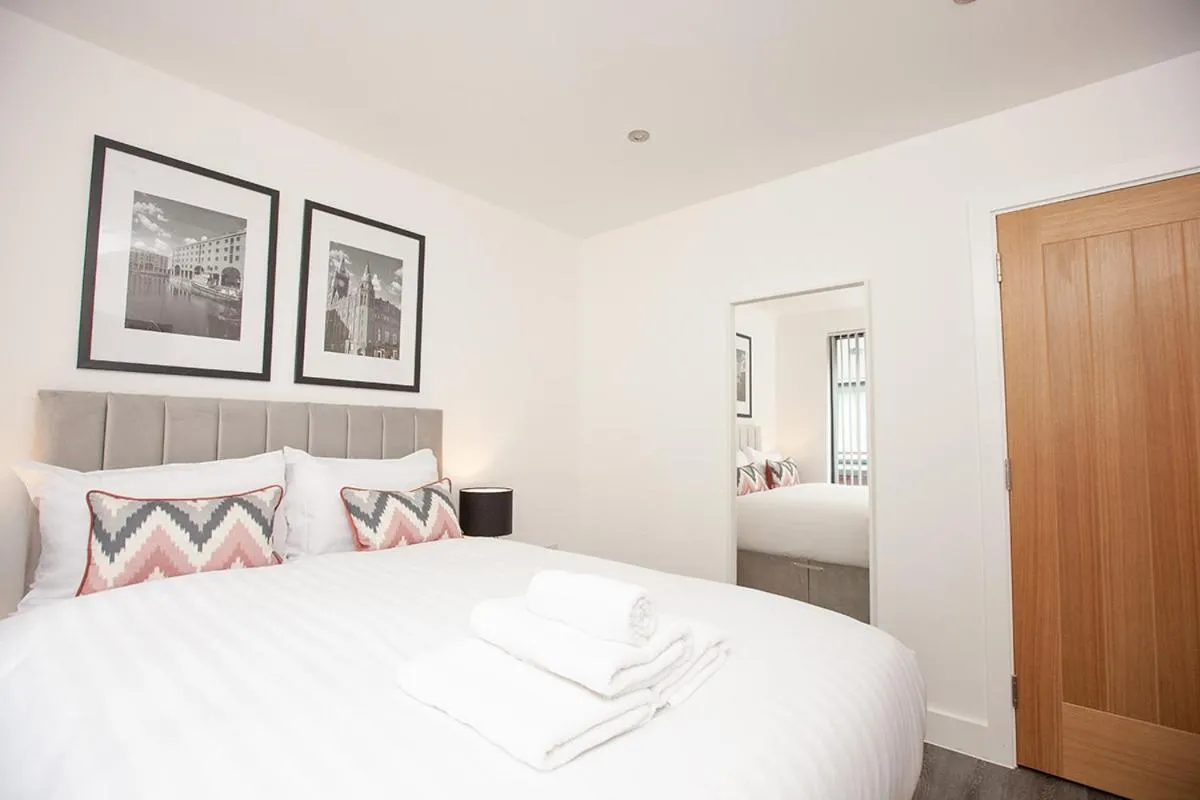 Bed in SGT Peppers Mathew Street Apartments By Happy Days