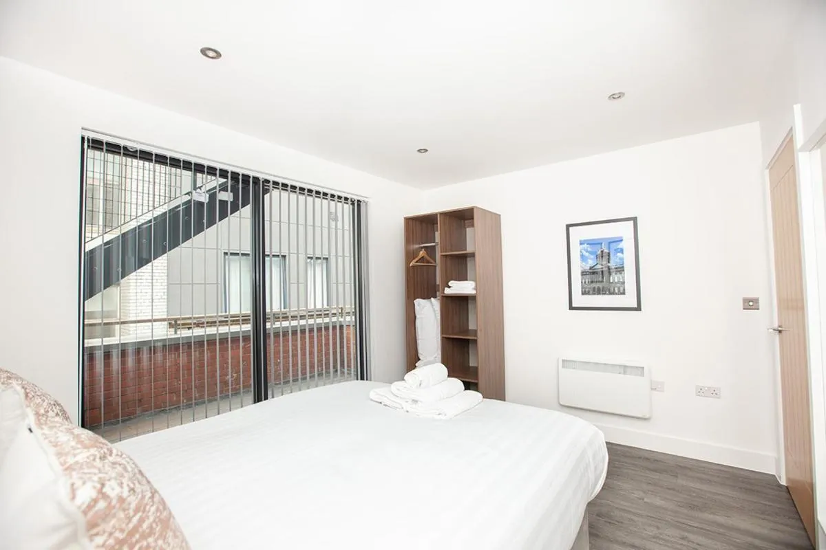 Bed in SGT Peppers Mathew Street Apartments By Happy Days