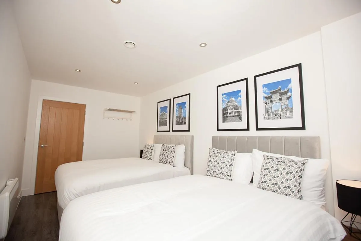 Bed in SGT Peppers Mathew Street Apartments By Happy Days