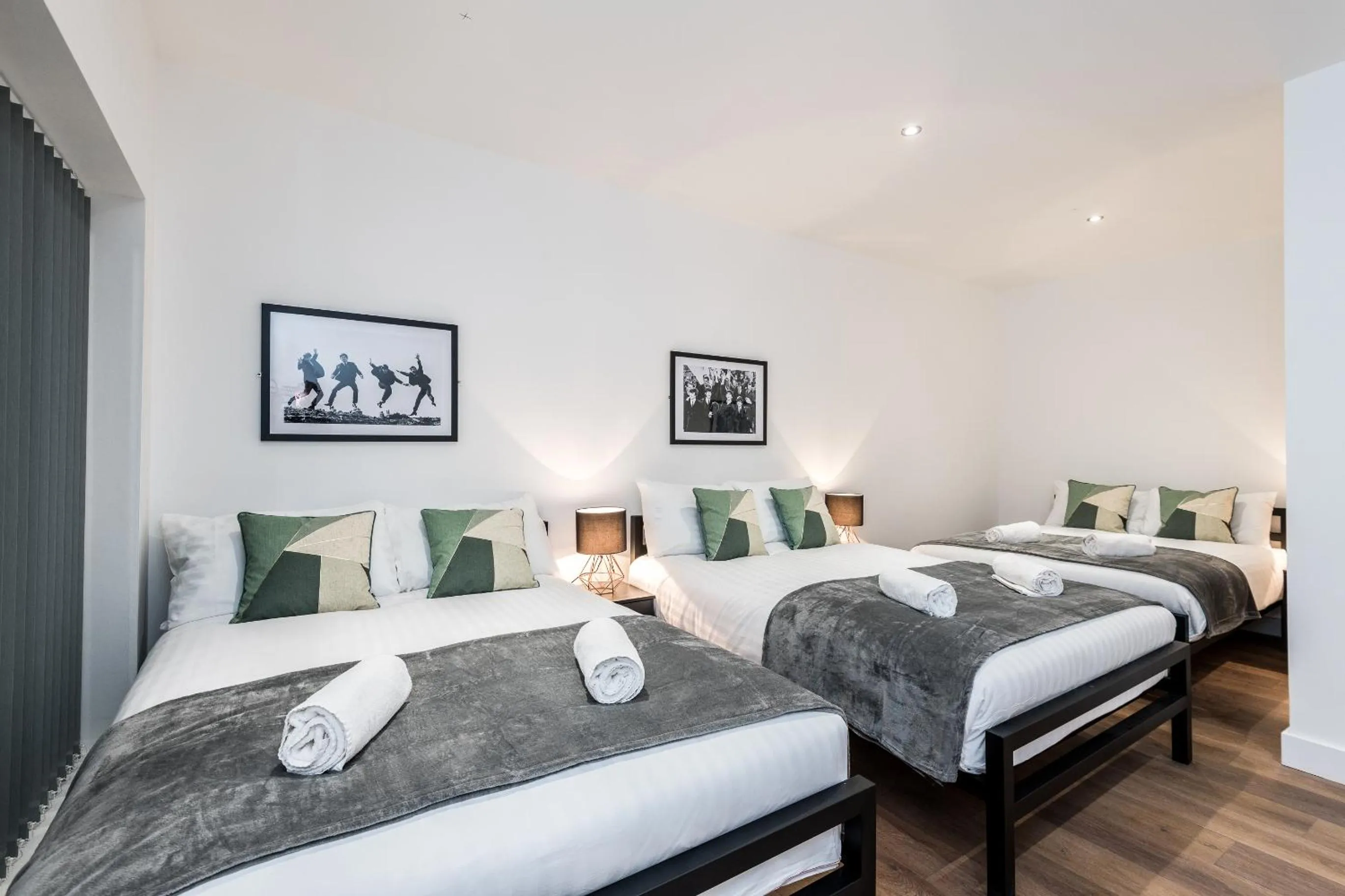 Bed in SGT Peppers Mathew Street Apartments By Happy Days