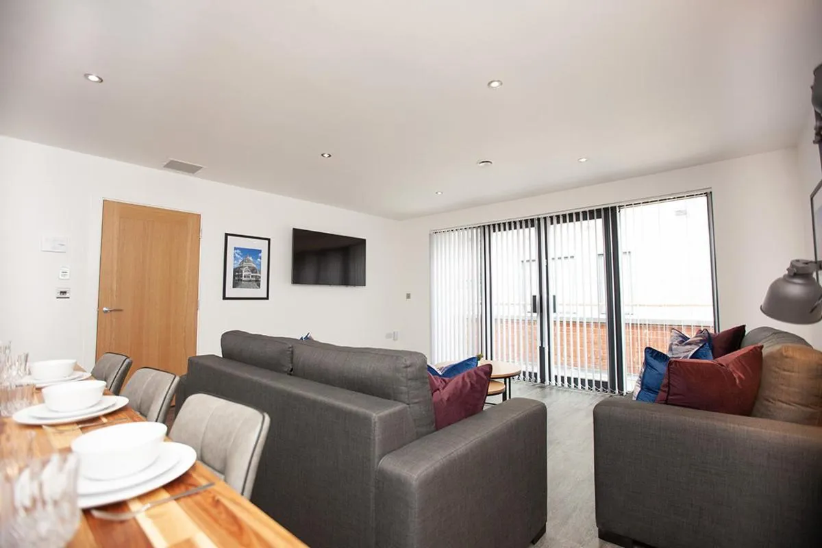 Living room in SGT Peppers Mathew Street Apartments By Happy Days