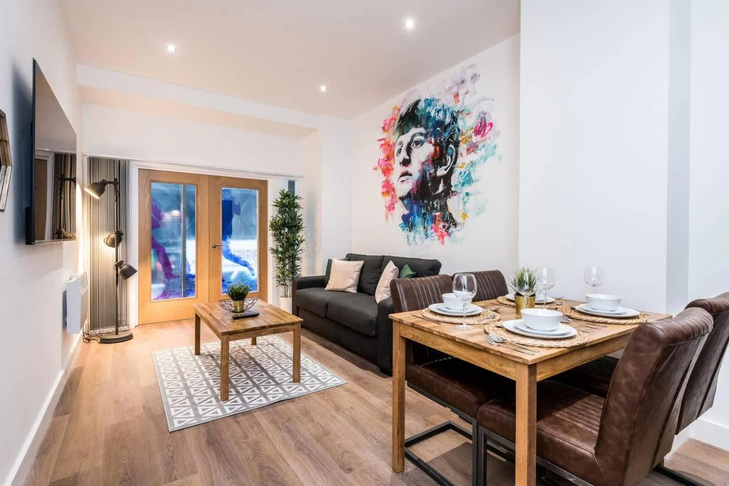 Living room in SGT Peppers Mathew Street Apartments By Happy Days