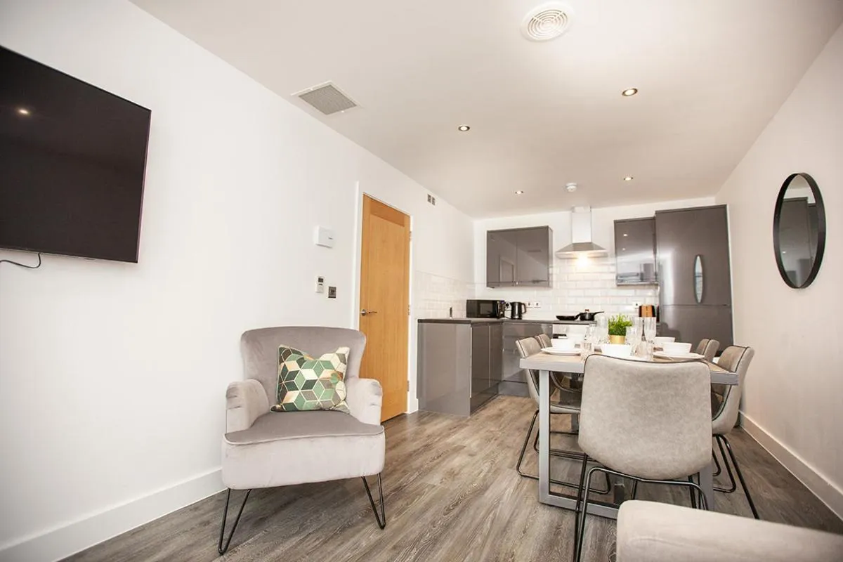 Living room in SGT Peppers Mathew Street Apartments By Happy Days