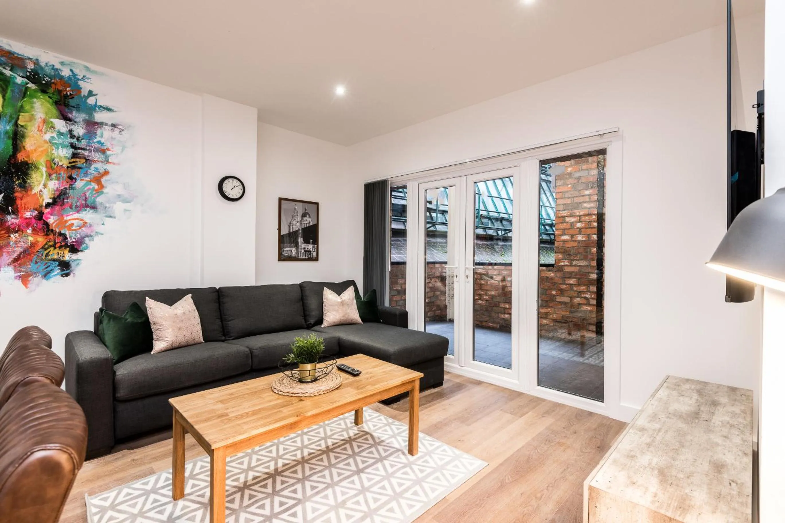 Living room in SGT Peppers Mathew Street Apartments By Happy Days