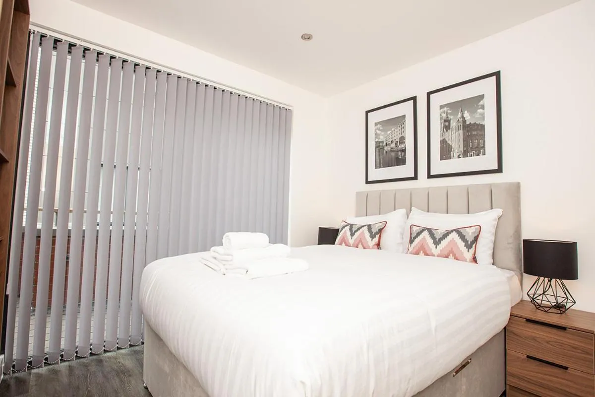 Bed in SGT Peppers Mathew Street Apartments By Happy Days