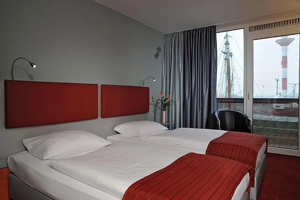 Photo of the whole room, Bed in Nordsee Hotel Fischereihafen