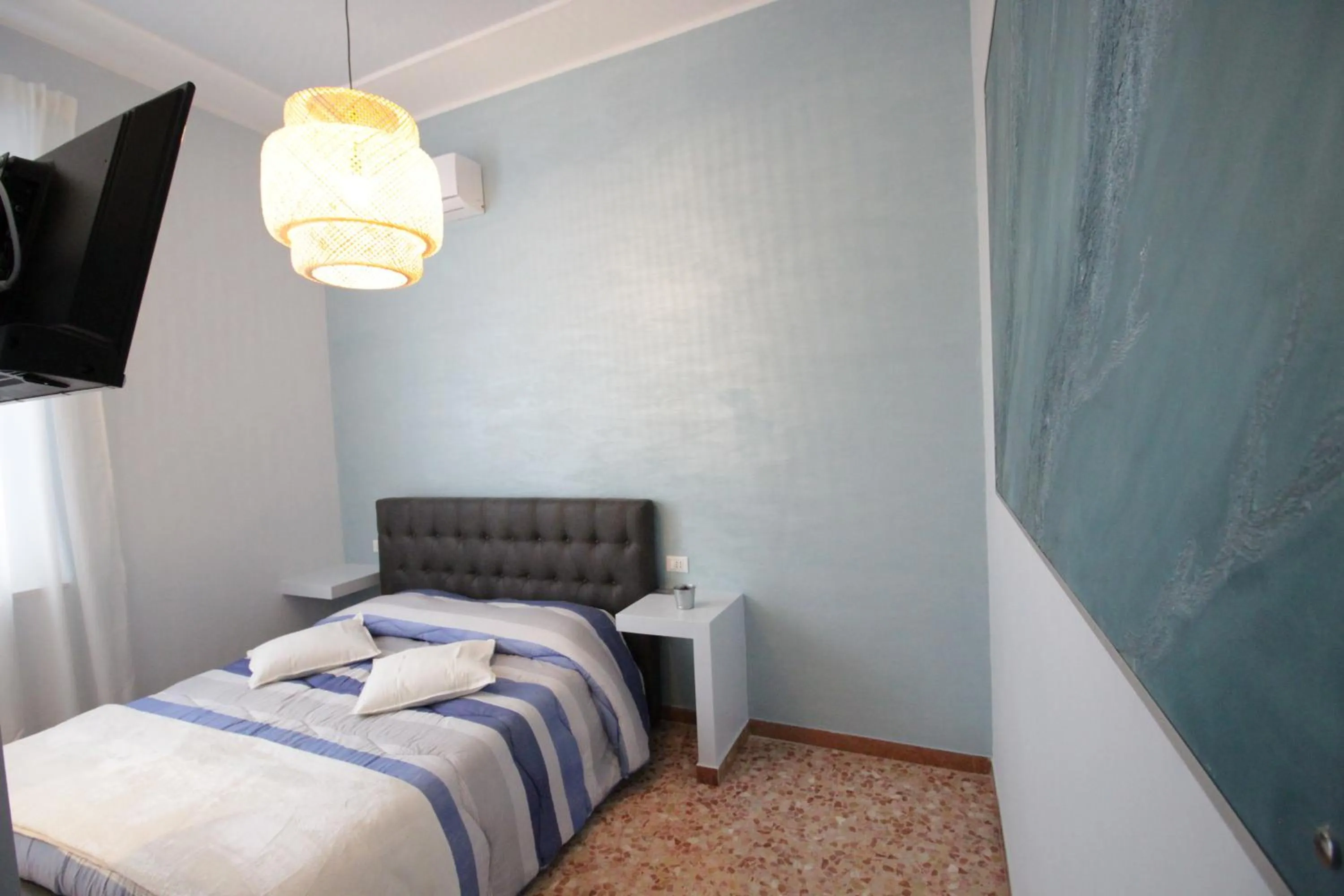 Bed in Ad Astra Rooms