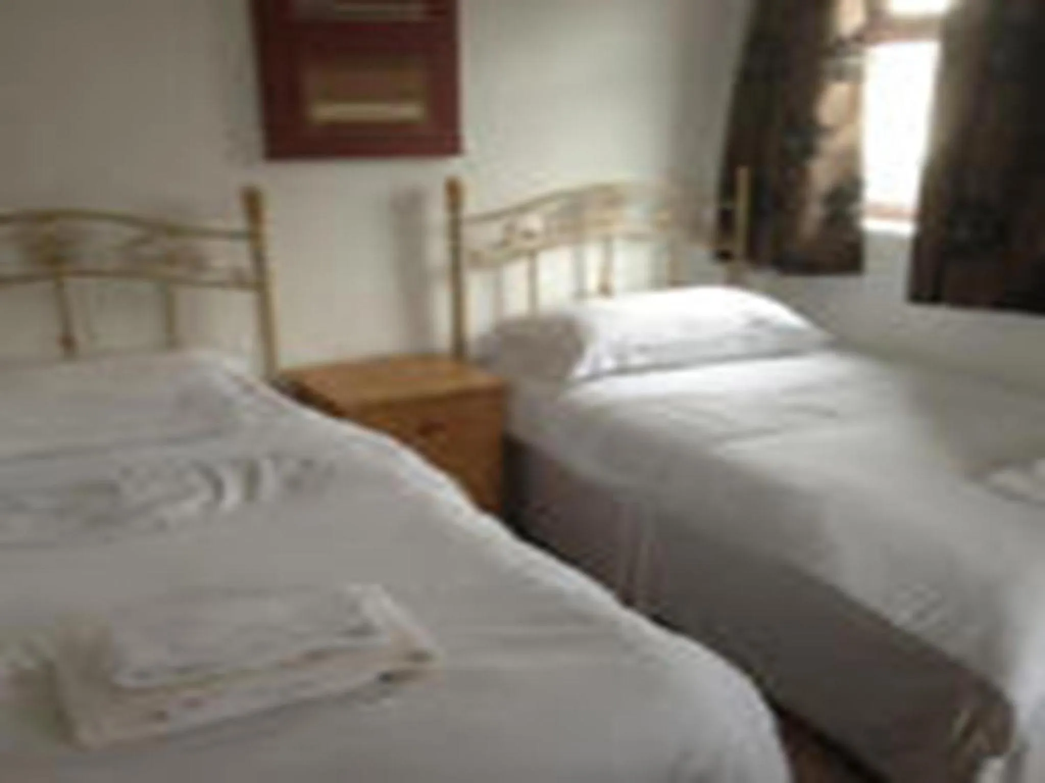Bed in Beverley Inn & Hotel